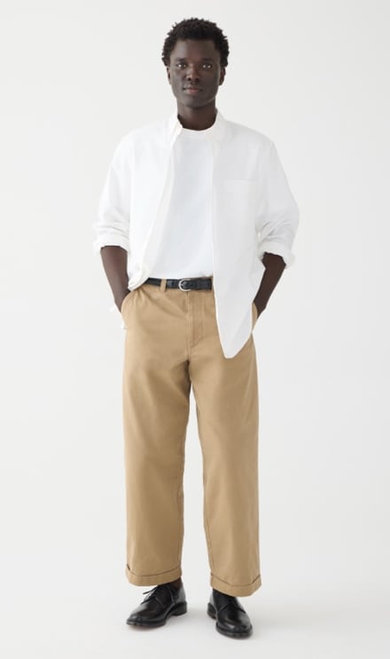 Men's khaki pants worn with a pale blue linen shirt and canvas sneakers  outfit | Shirt outfit men, Blue shirt men, Khaki pants outfit men