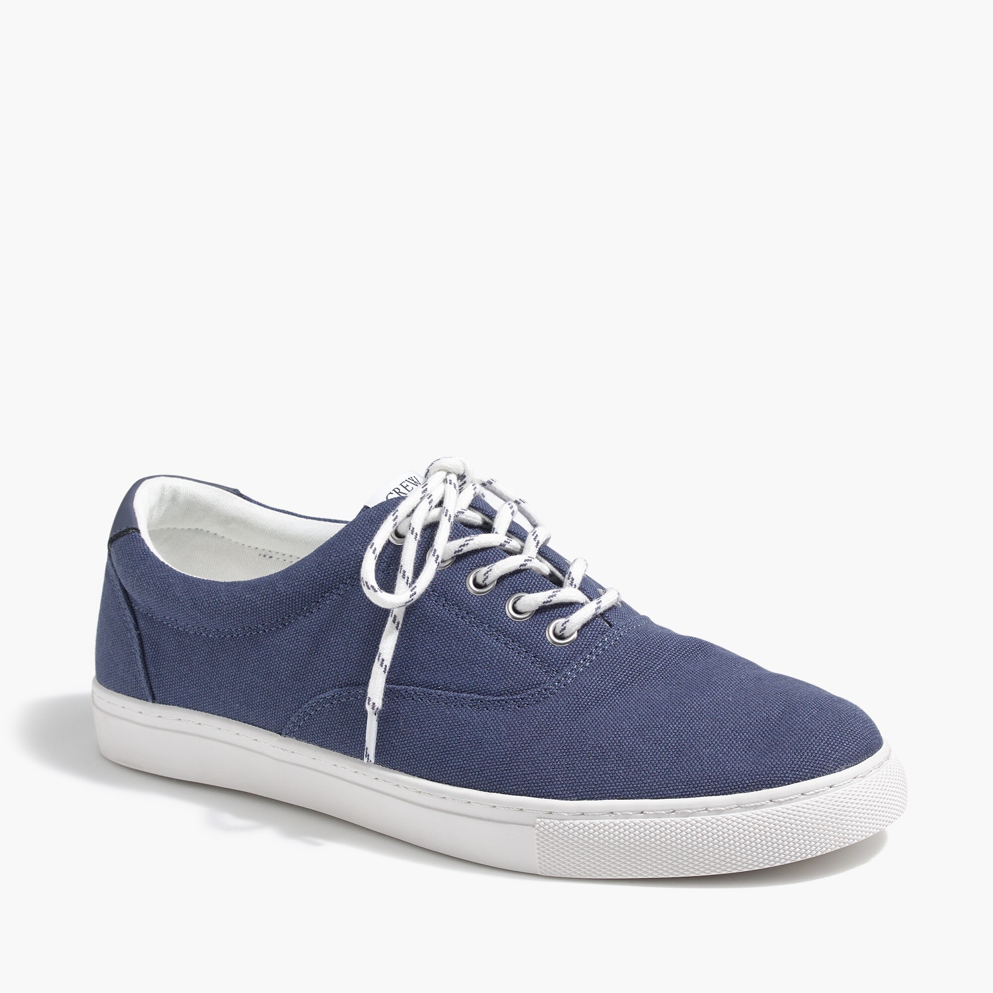 white canvas lace up sneakers