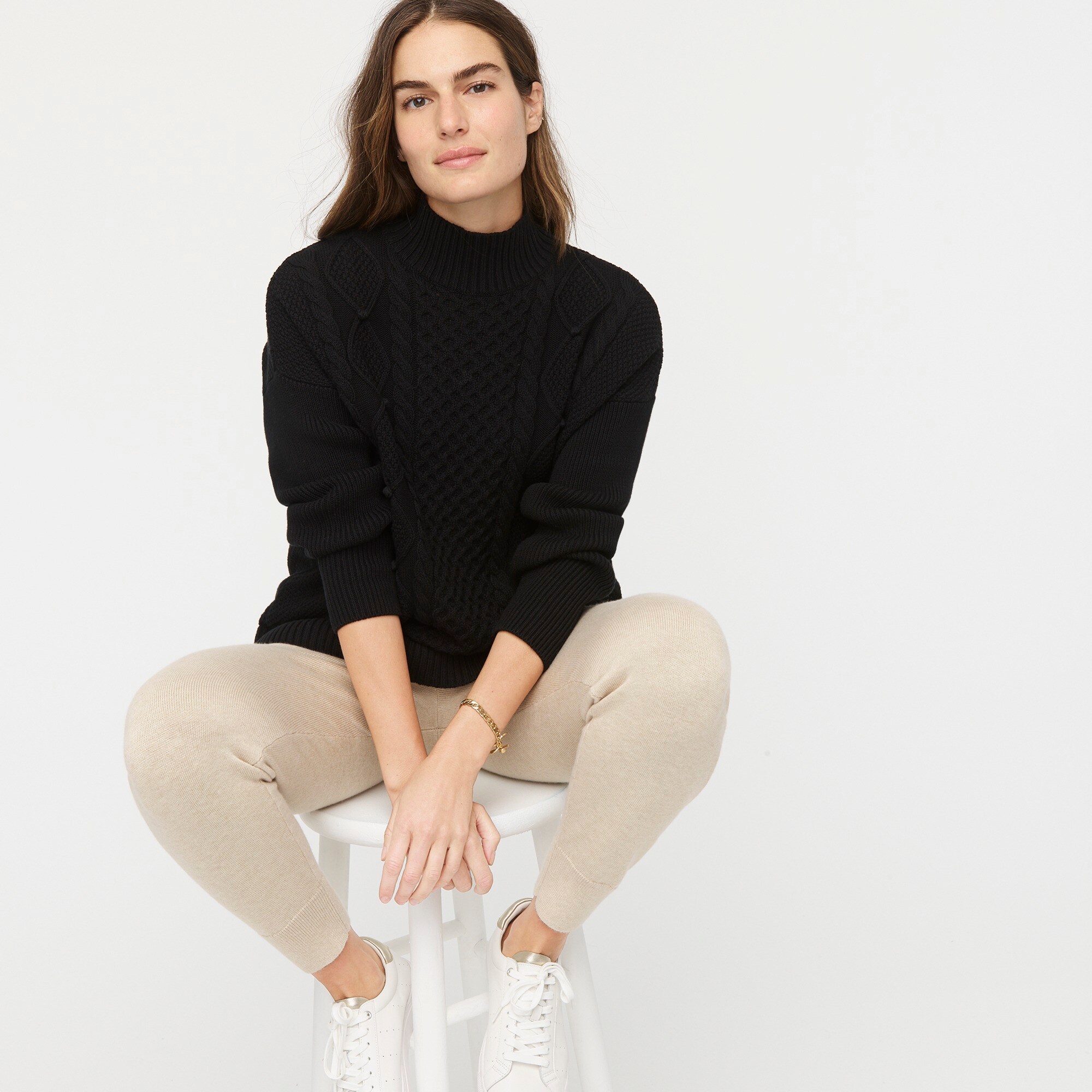 Swingy cable-knit mockneck sweater