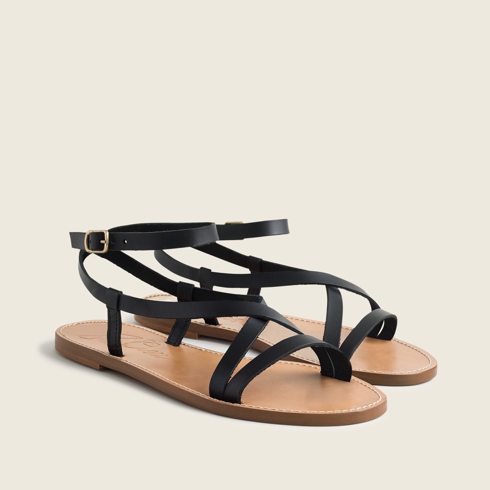 Flat strappy sandals in vachetta leather