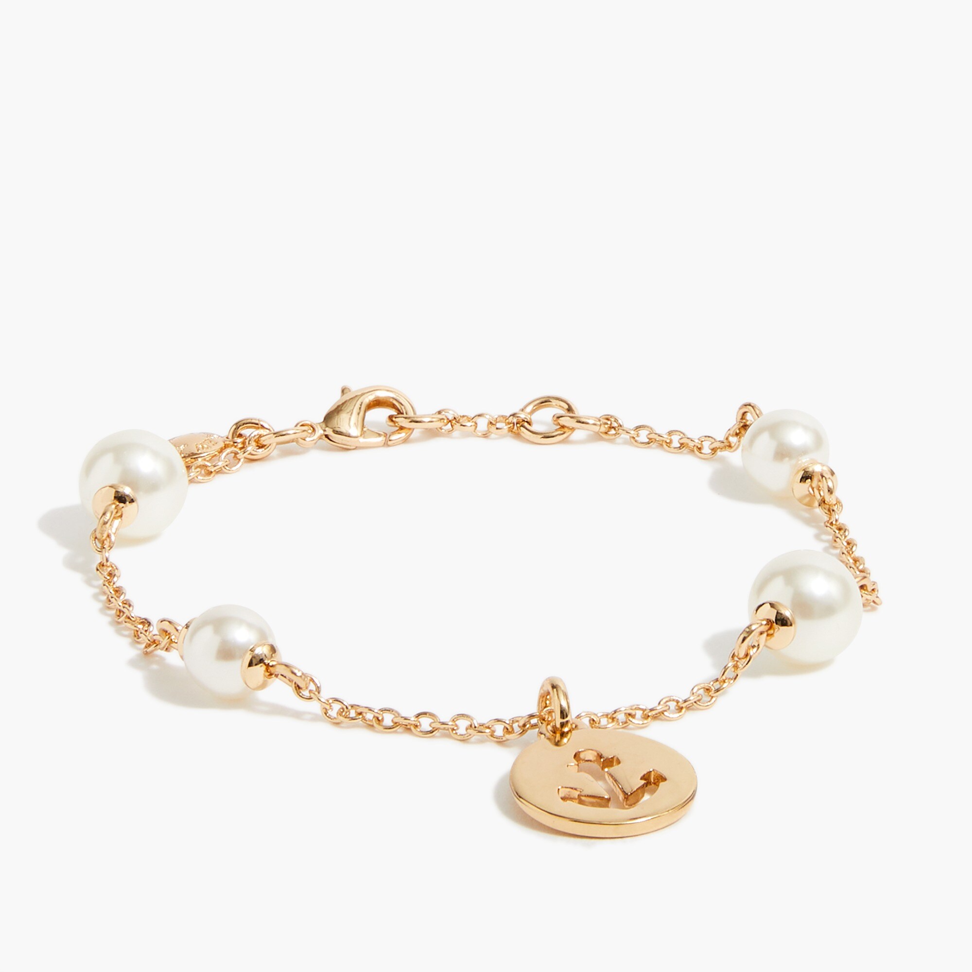 Pearl bracelet with anchor-stamped coin