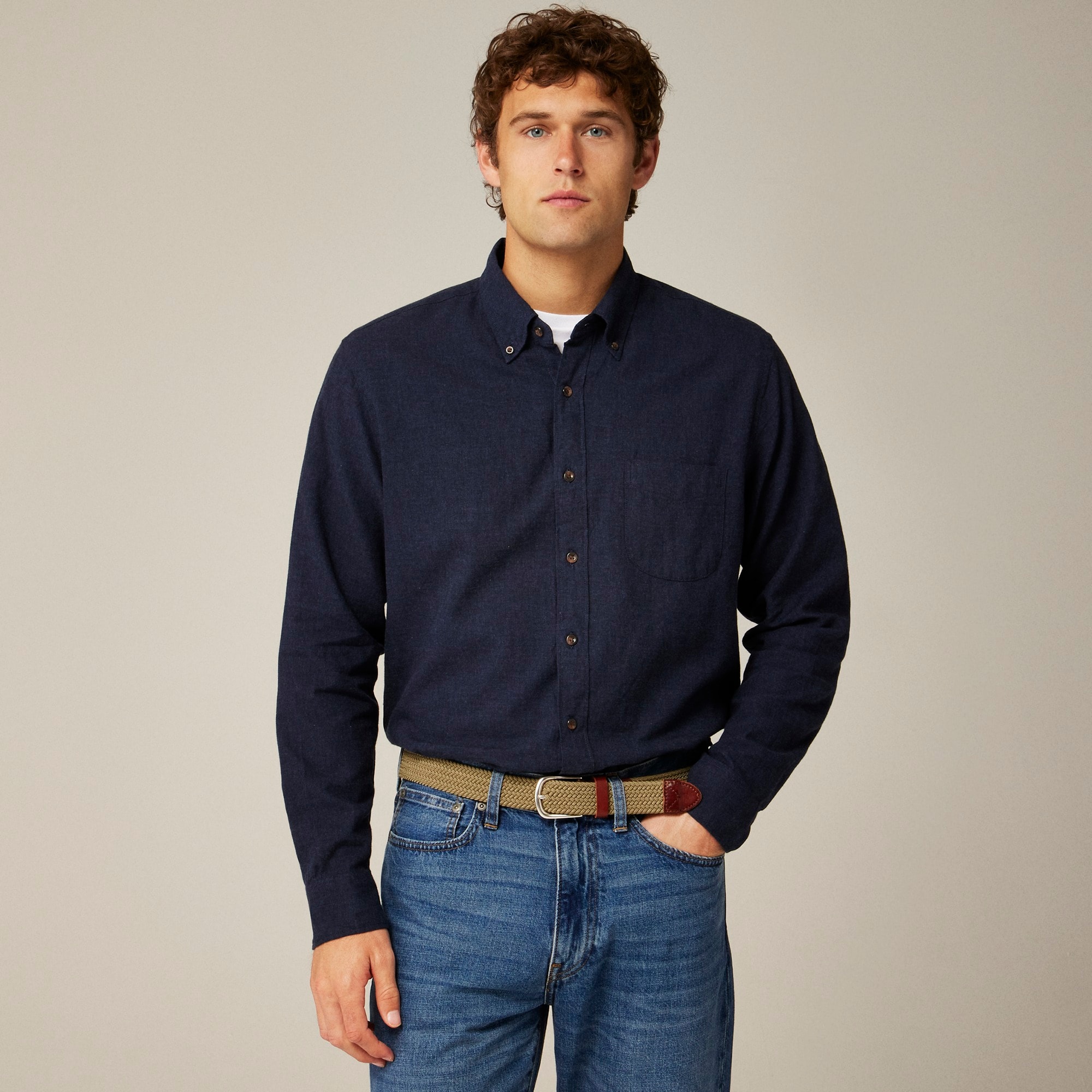 A man in a long-sleeved blue button-up shirt