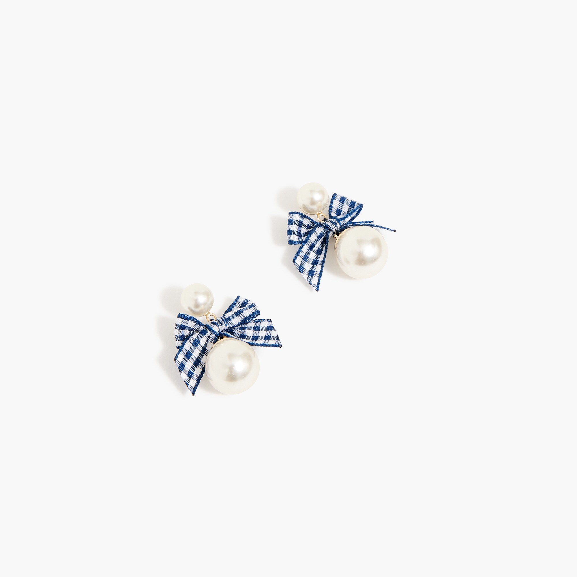 Pearl and bow statement earrings