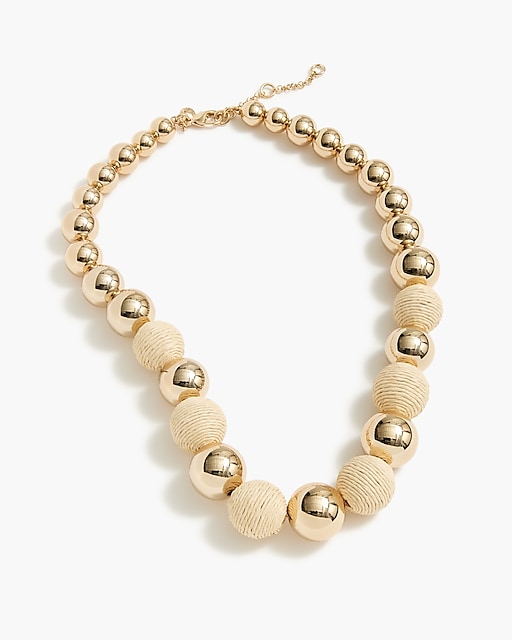 womens Gold bead and straw statement necklace