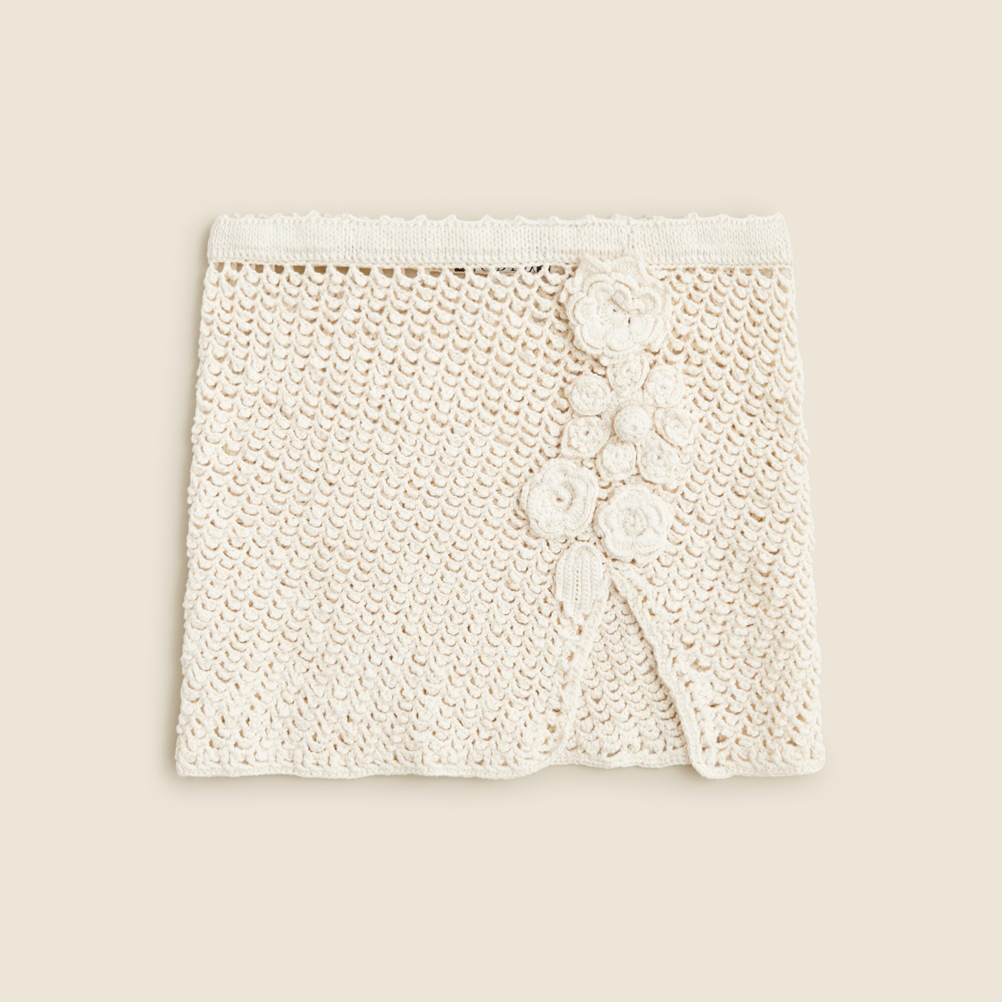 Crochet mini skirt with floral appliqués