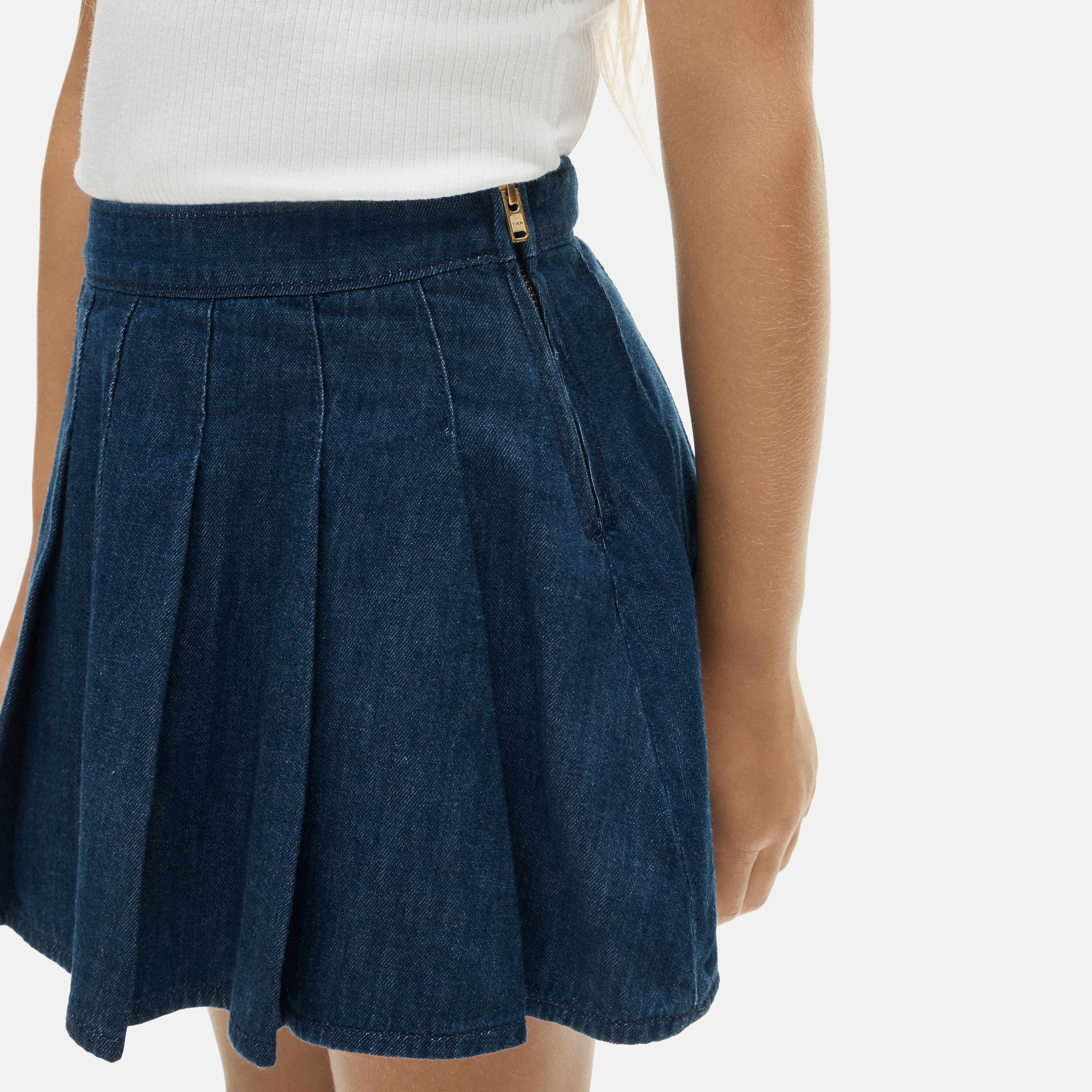 Girls' pleated skirt in drapey denim