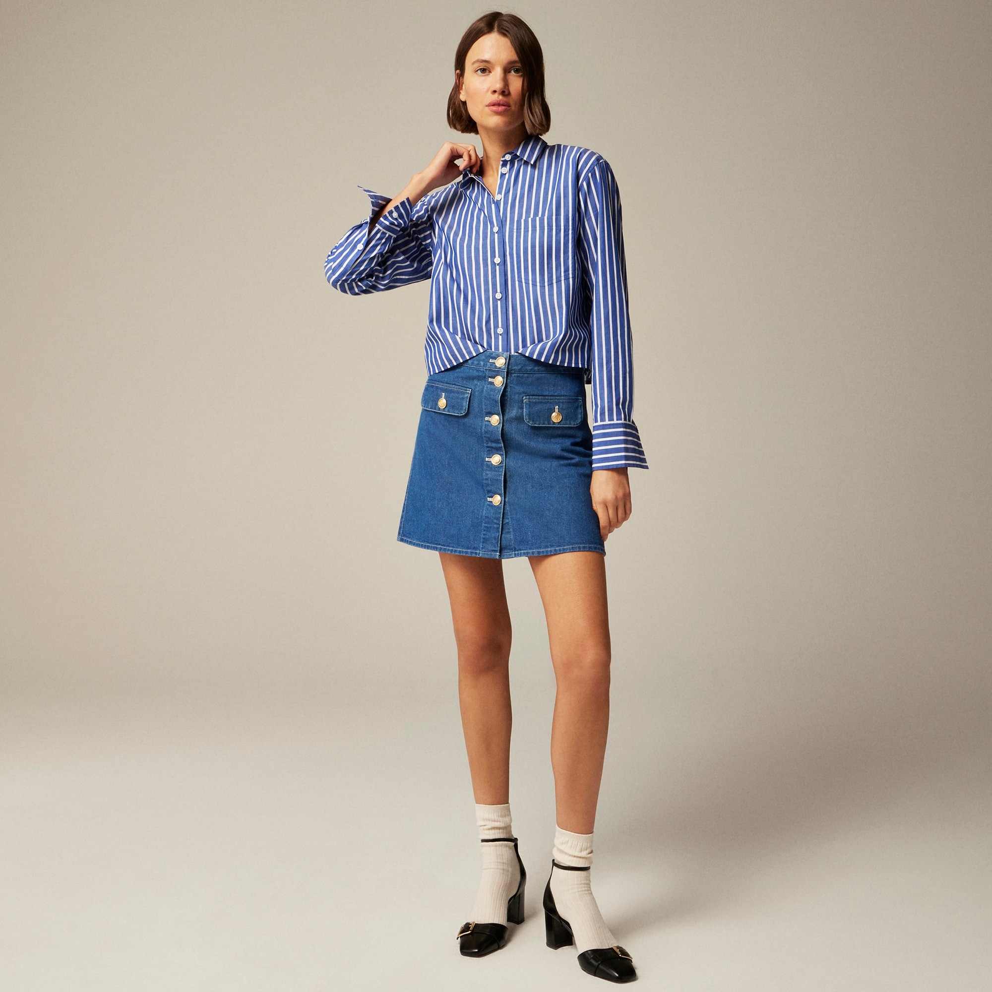 Button-front denim mini skirt