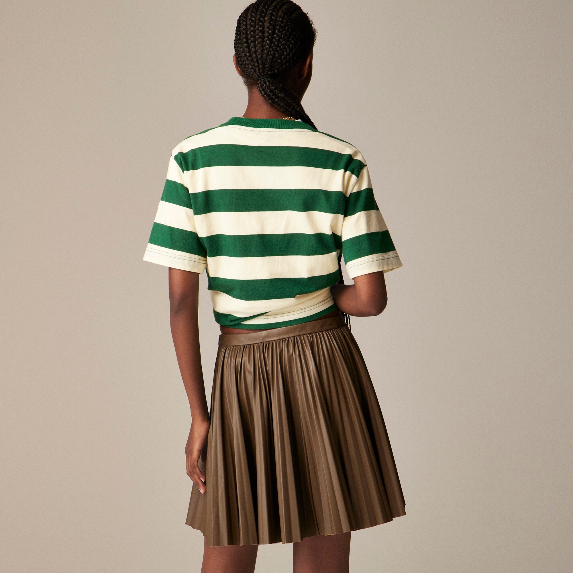 Swingy pleated mini skirt in faux leather