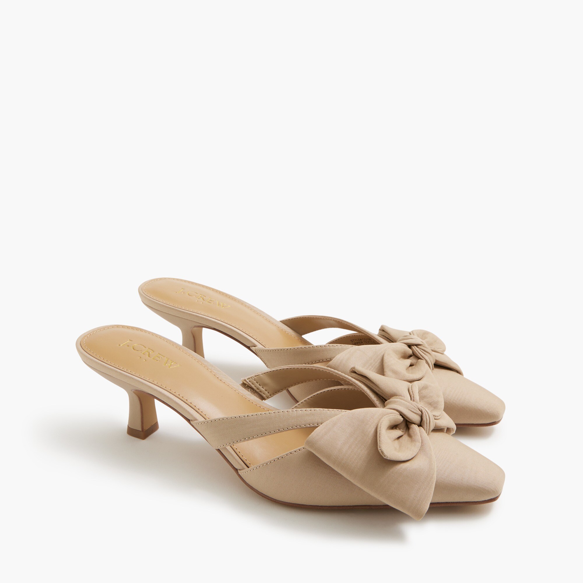 Bow heeled mules