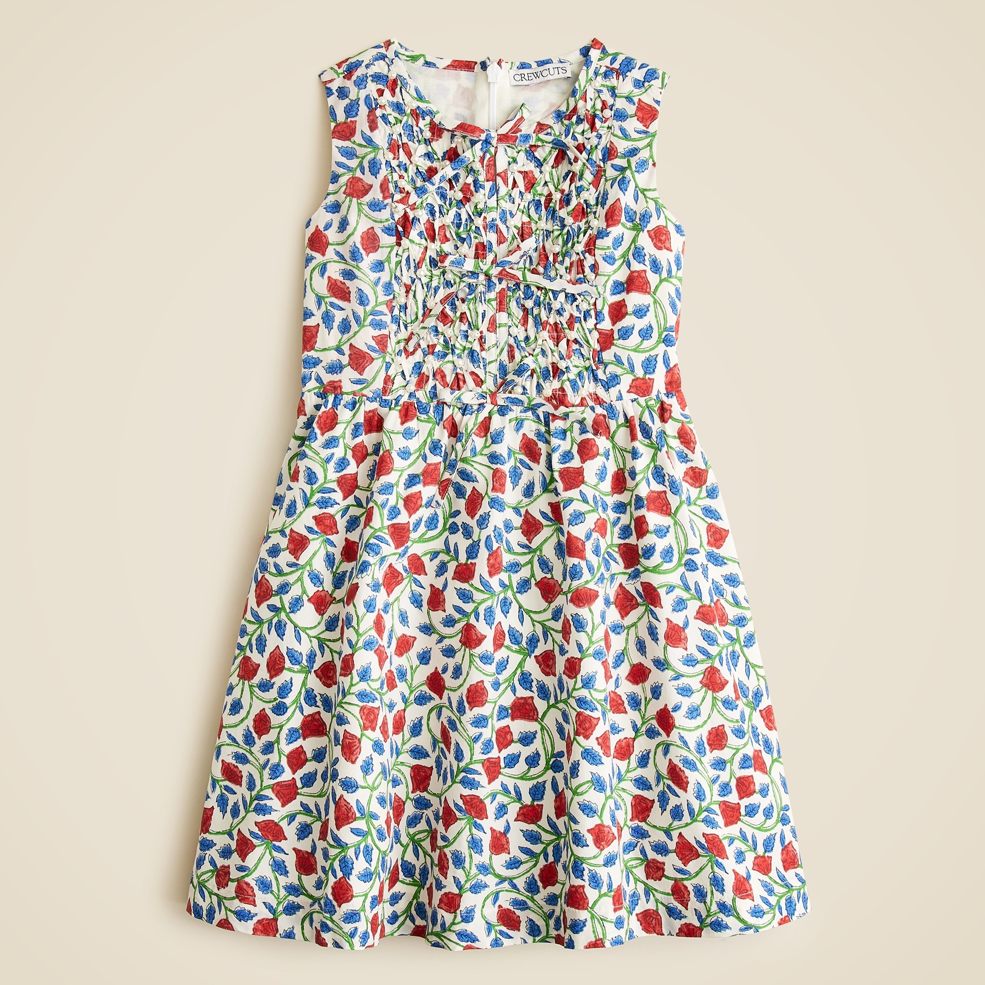 Girls' smocked floral dress with pearl embellishments