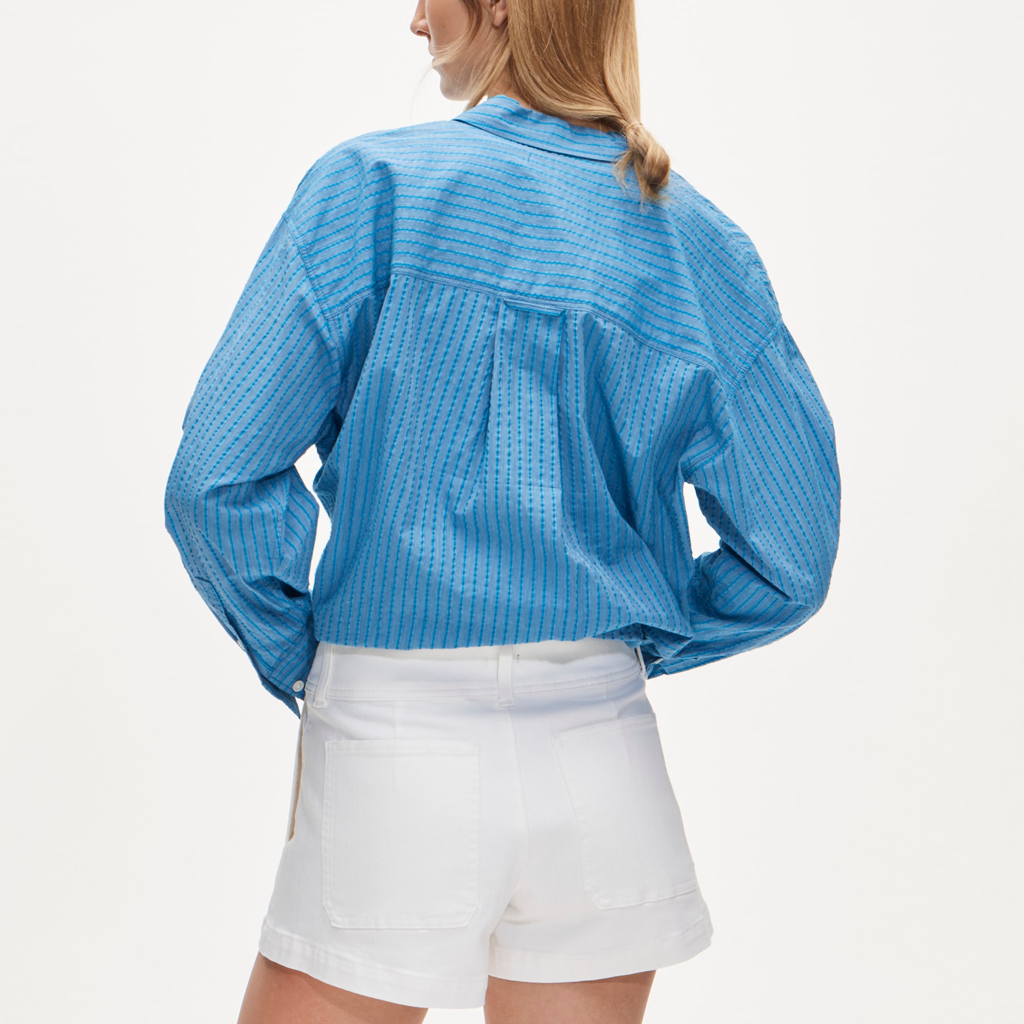 Stacked-button denim short in white - image 4