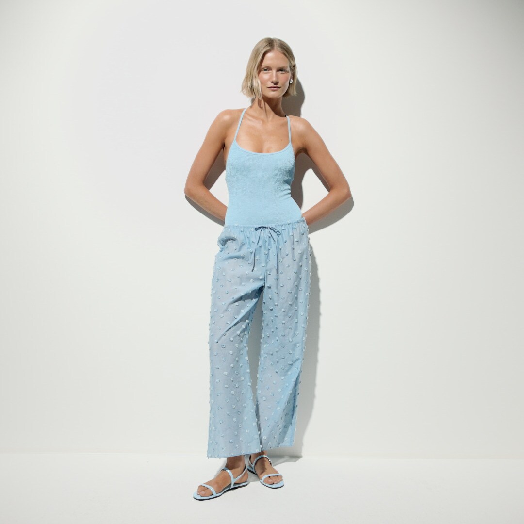 Beach pant with pom-poms