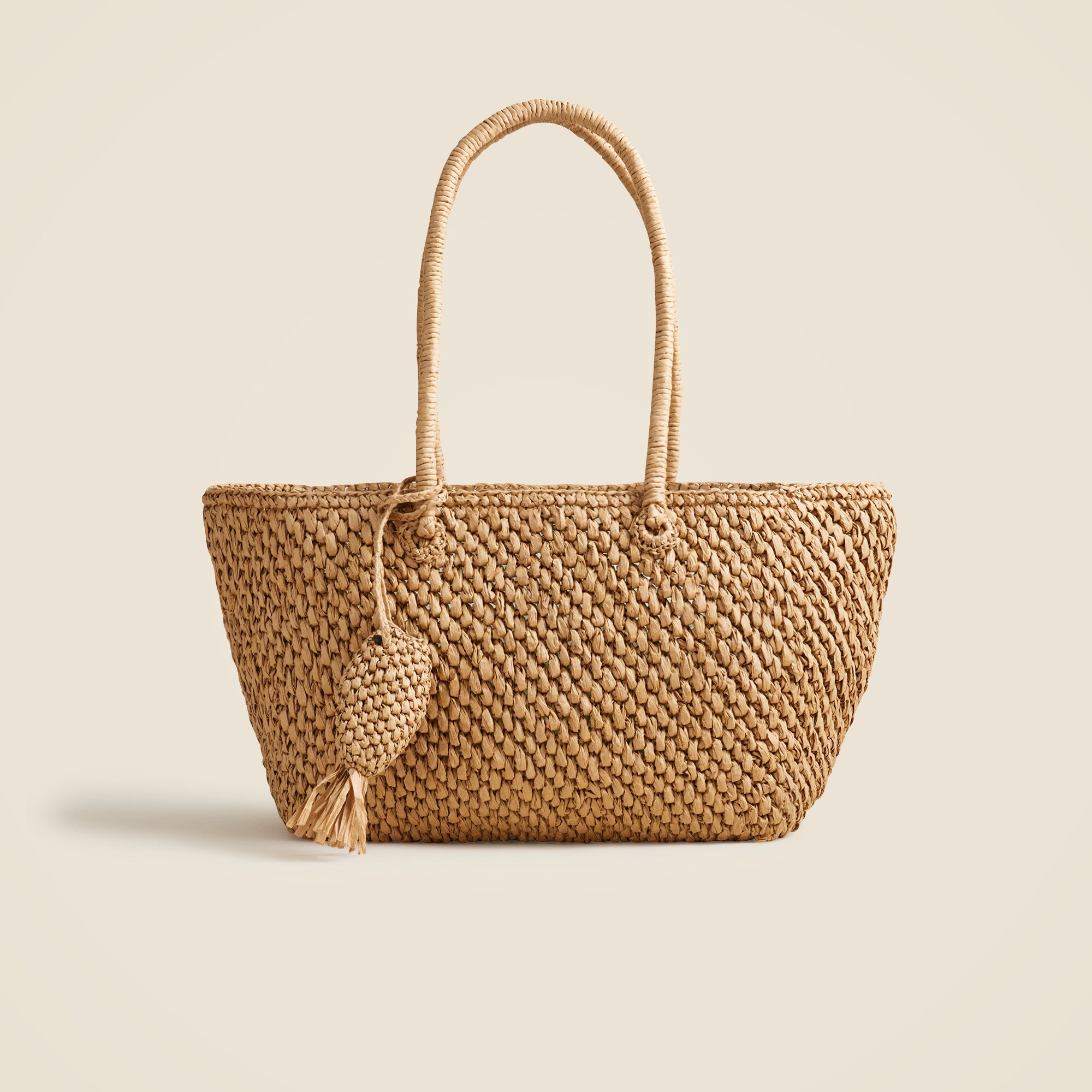 Handknotted large straw tote with fish charm