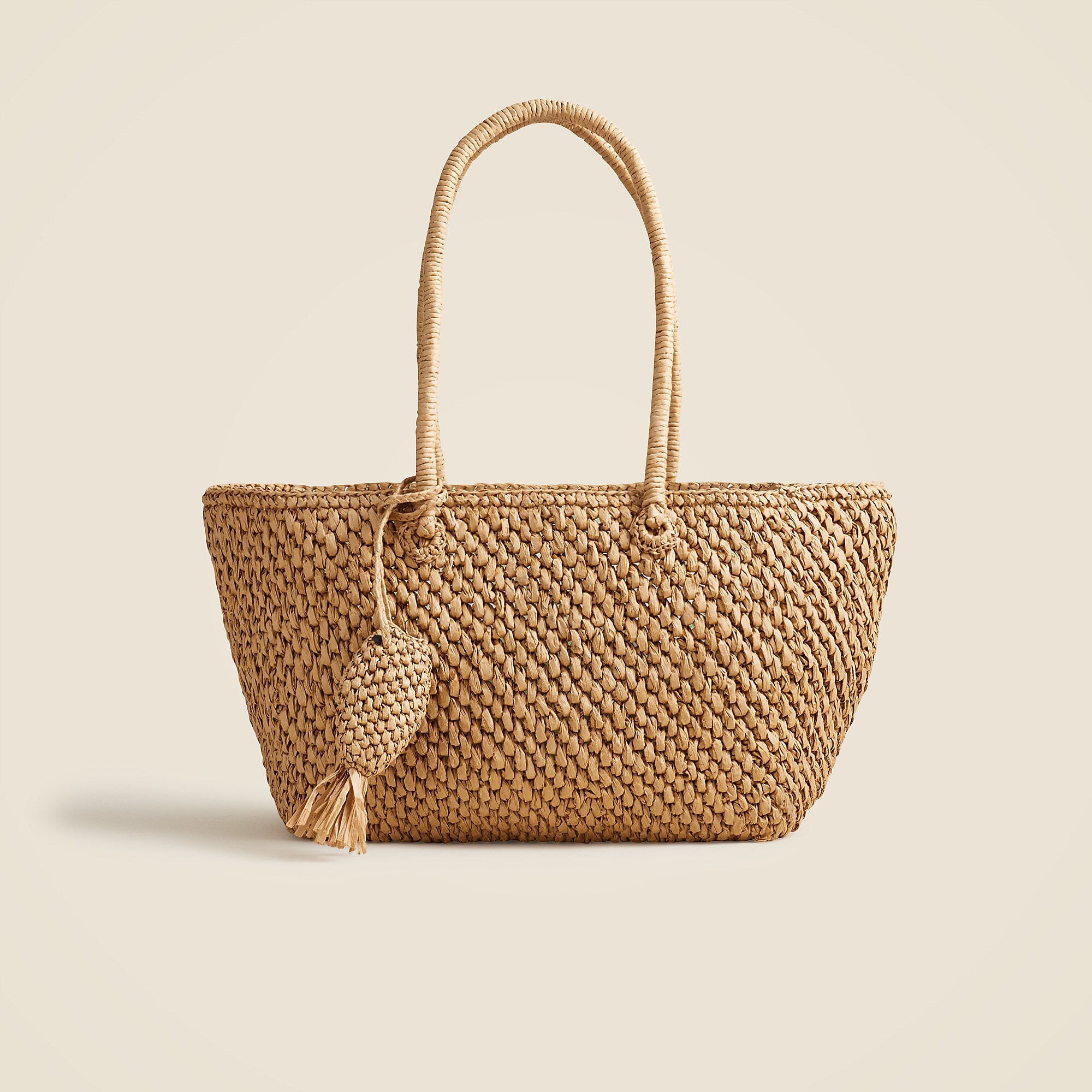 Handknotted large straw tote with fish charm