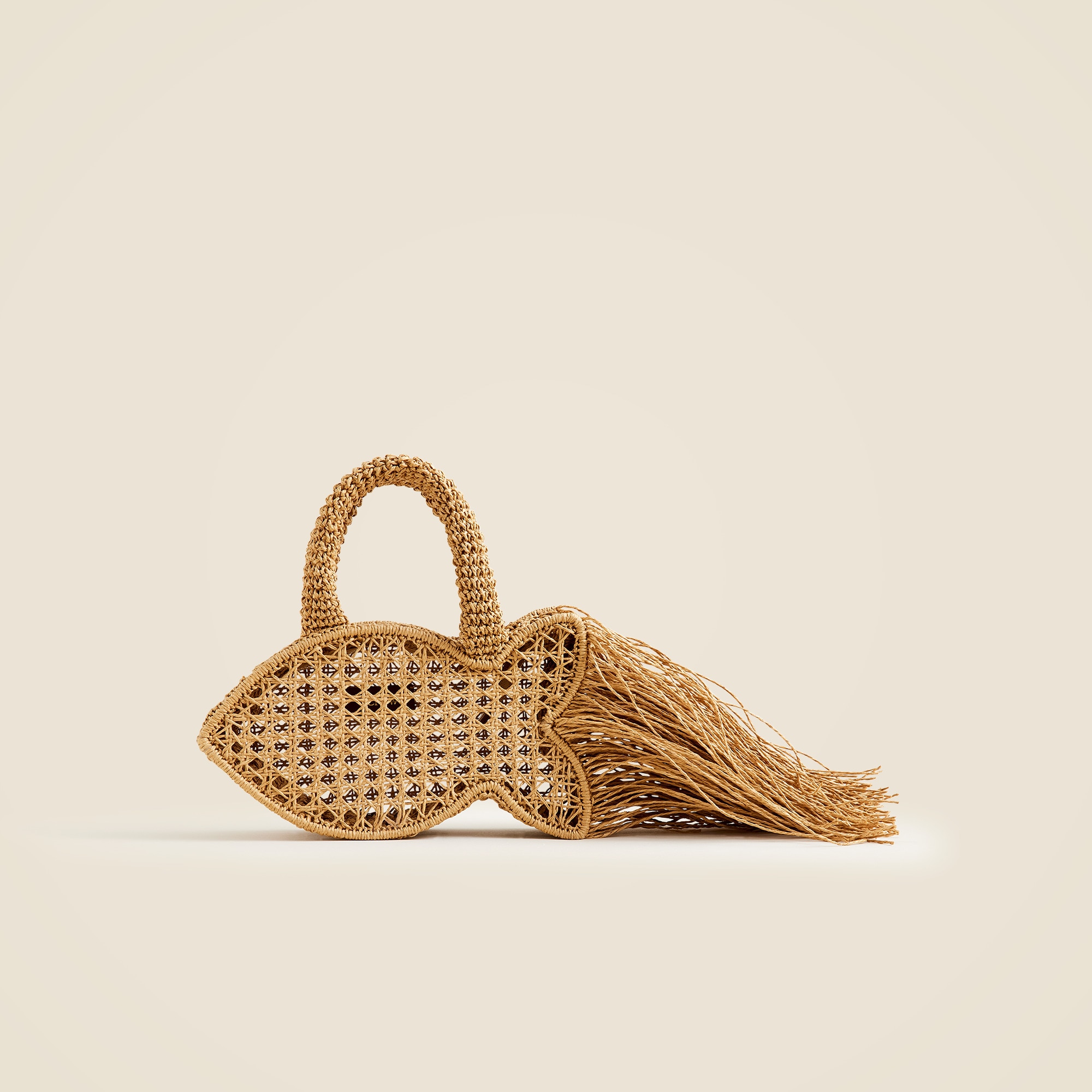 Handknotted raffia fish bag with straw fringe