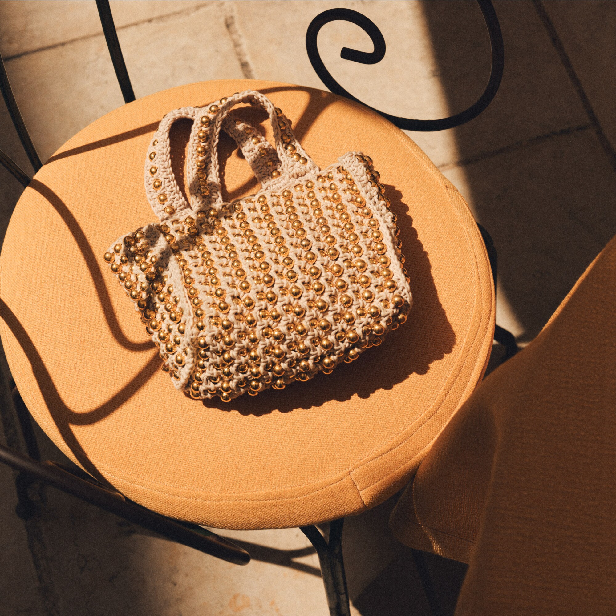 Small handknotted crochet bag with beads