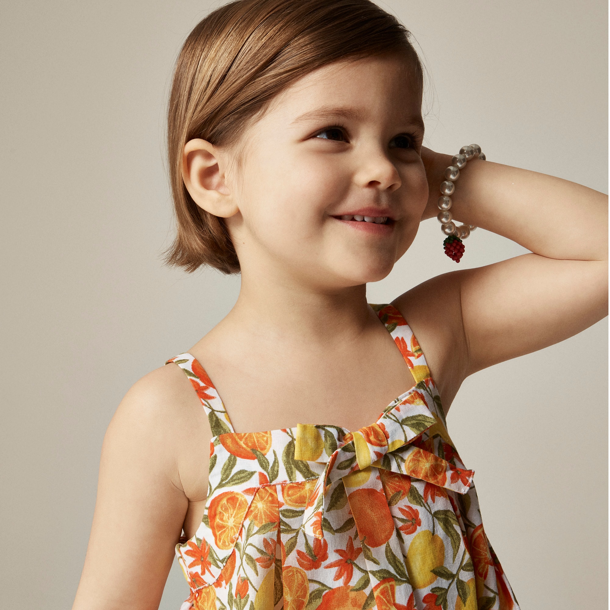 Girls' bow tie dress in linen citrus print