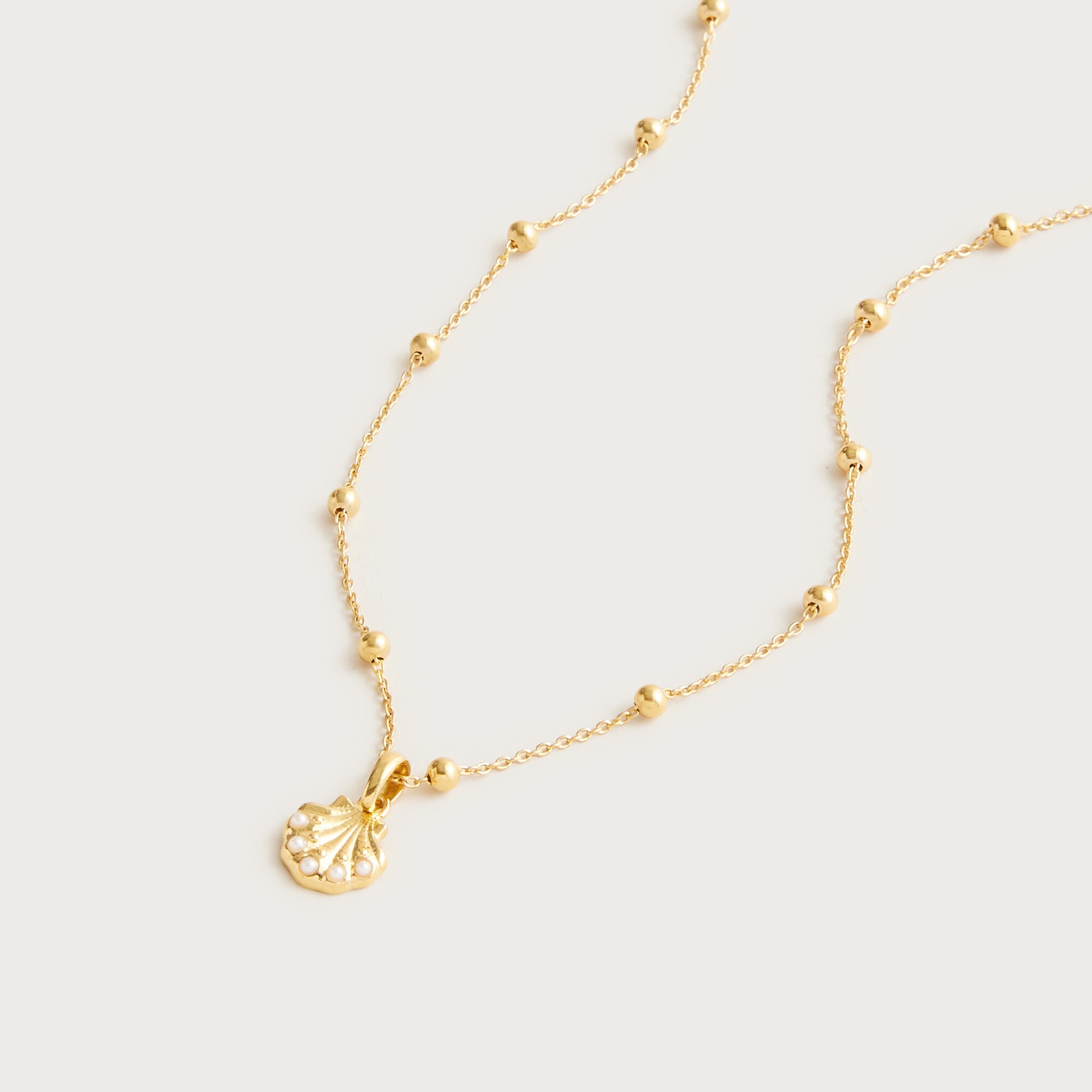 Gold vermeil seashell charm necklace
