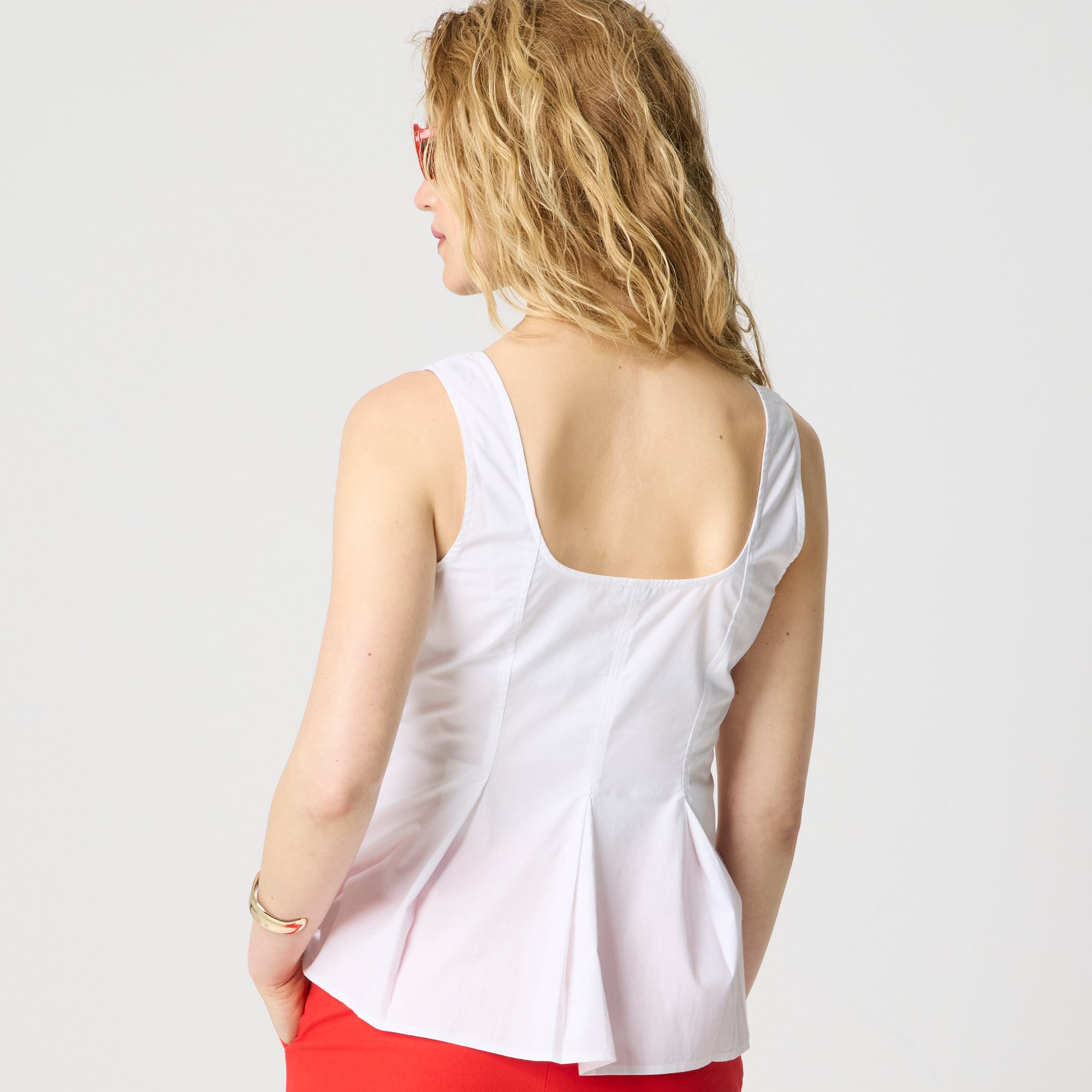 Sleeveless button-up peplum top