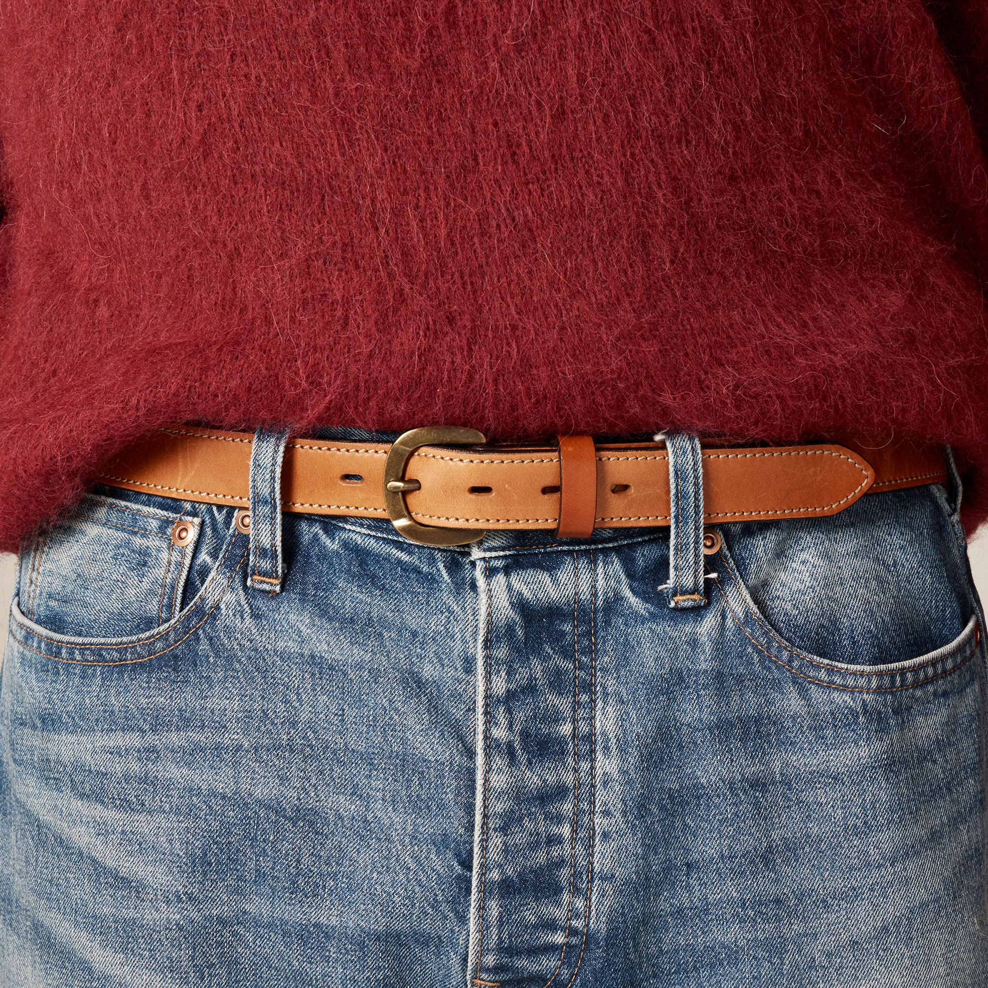 Leather belt with round brass buckle
