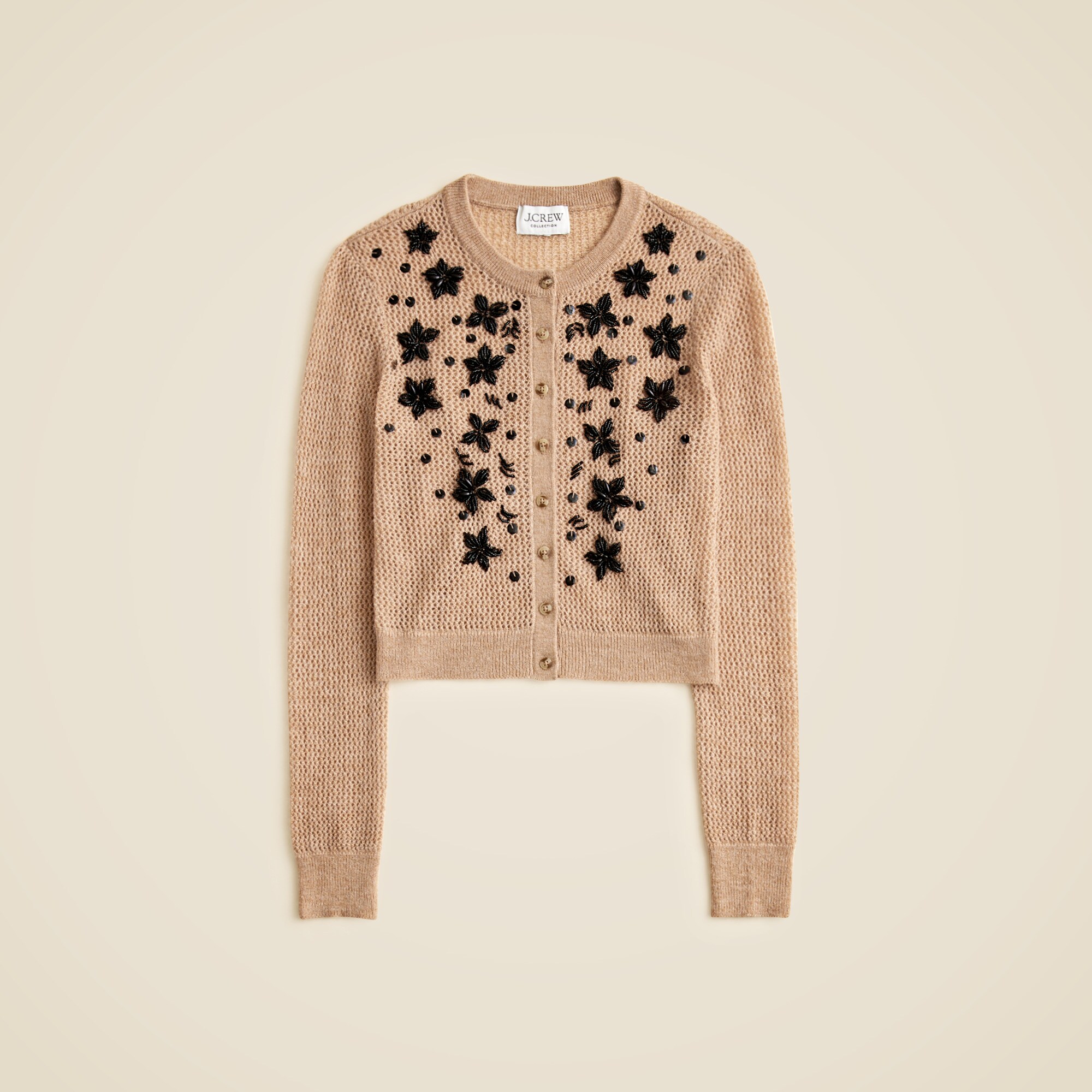 Loose-knit cardigan with floral embellishments