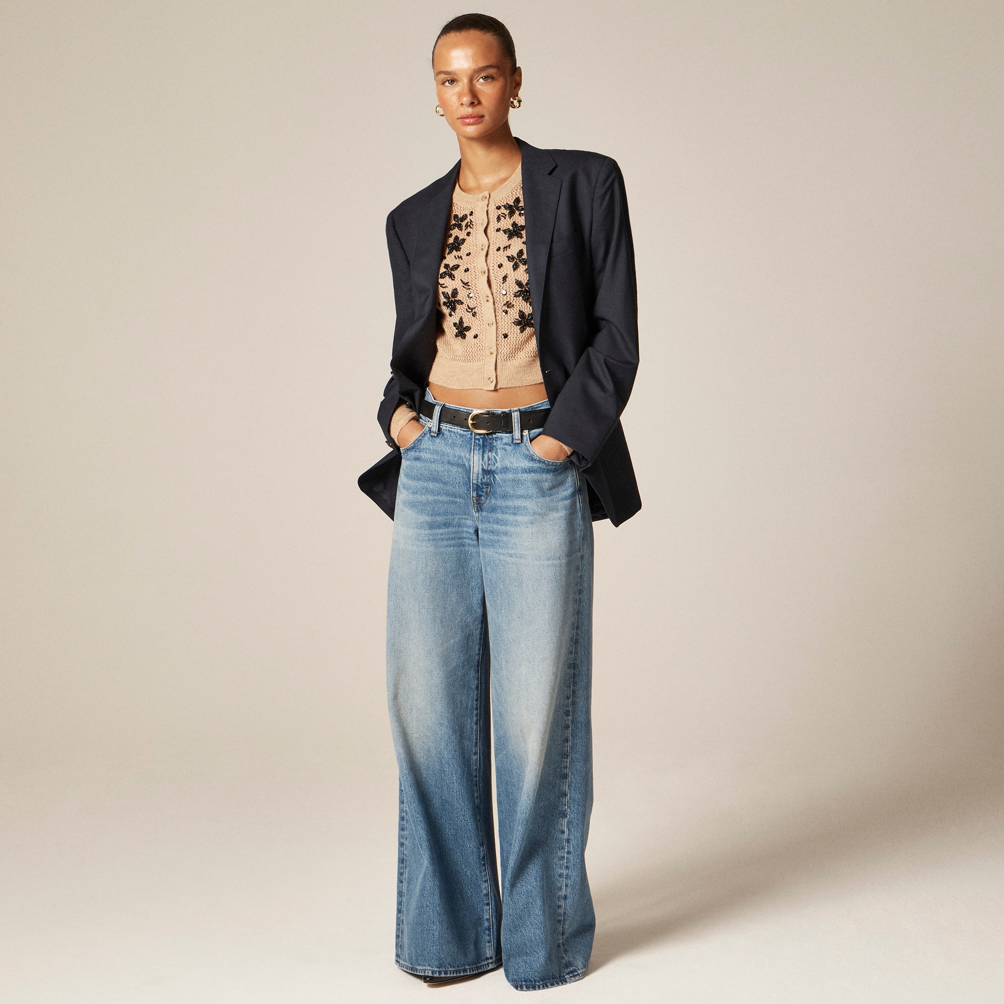 Loose-knit cardigan with floral embellishments