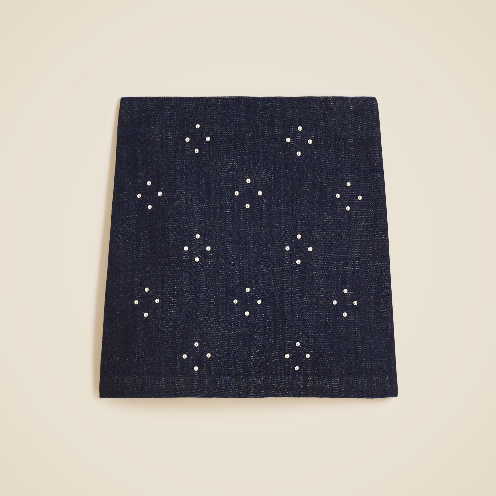 Mini denim skirt with stud embellishments