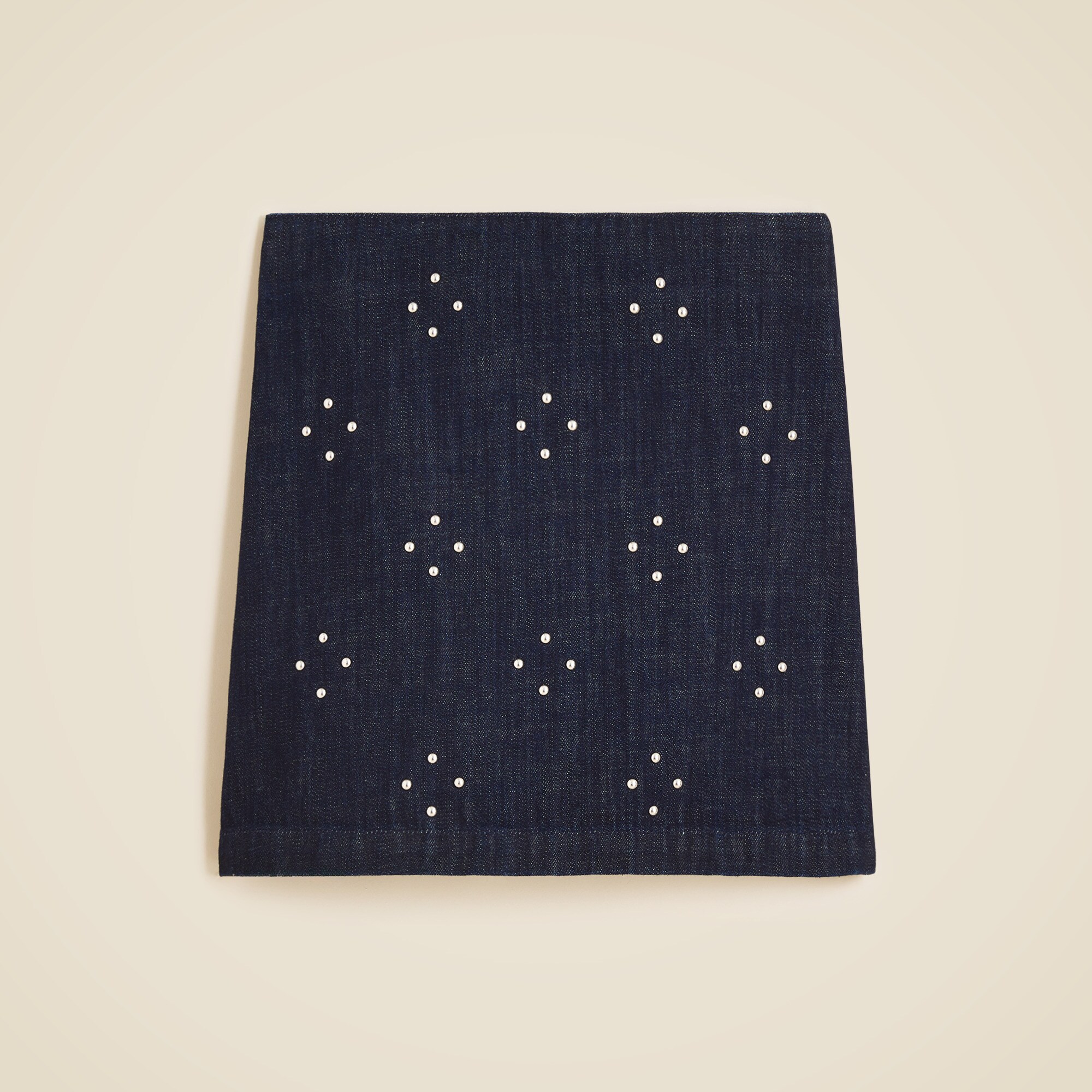 Mini denim skirt with stud embellishments