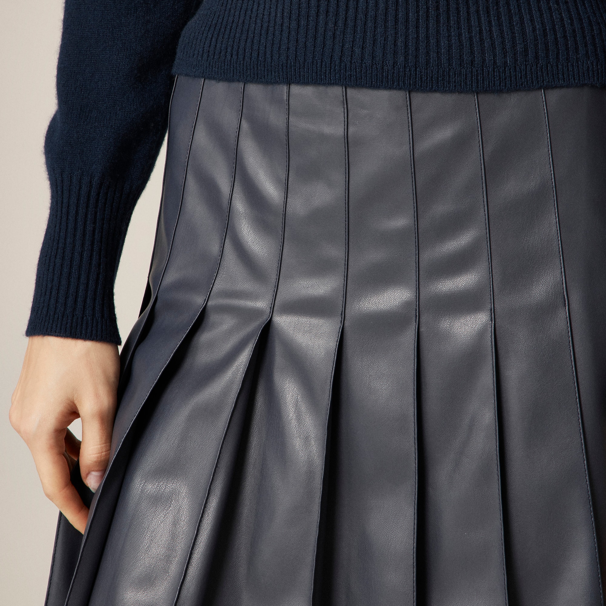 Pleated knee-length skirt in faux leather