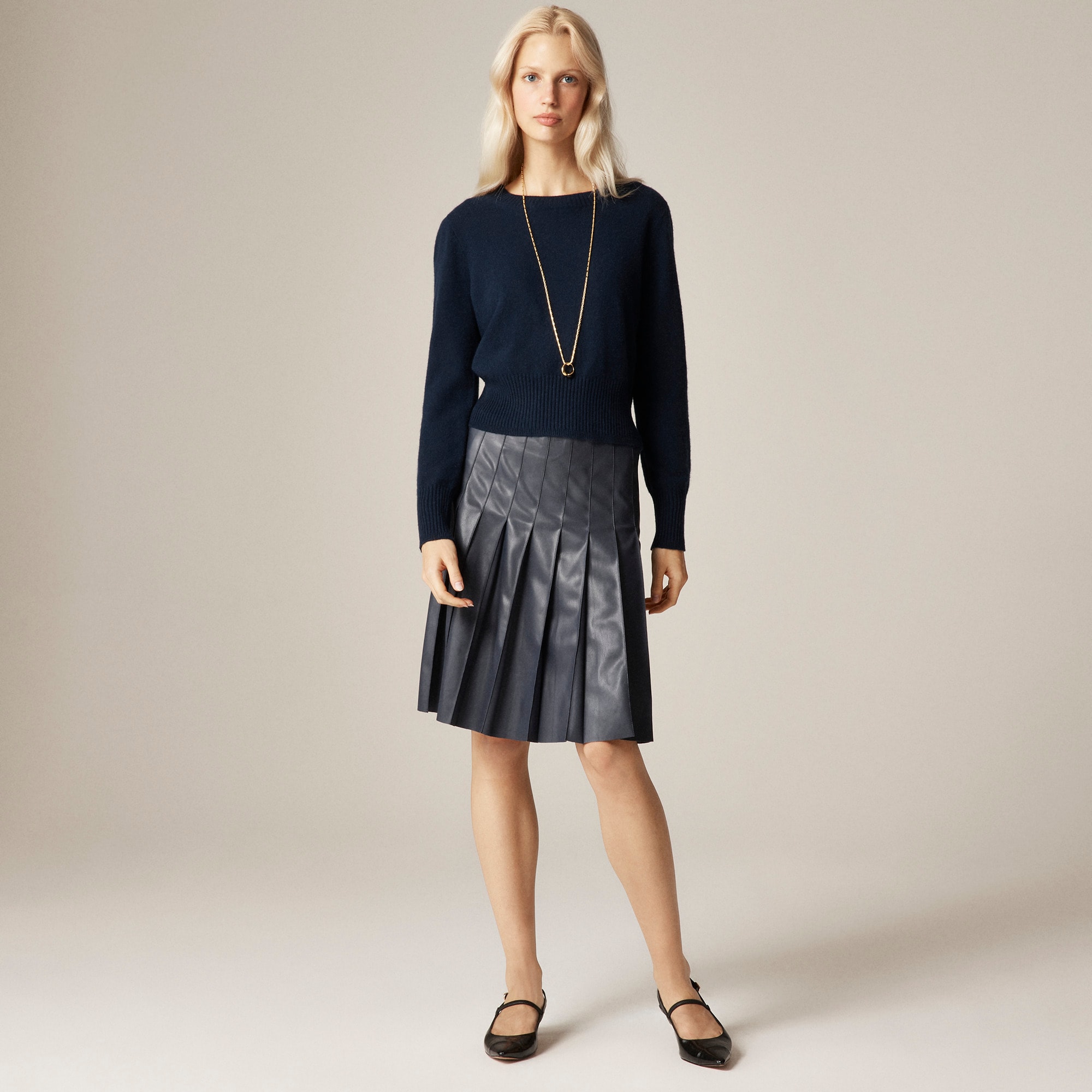 Pleated knee-length skirt in faux leather