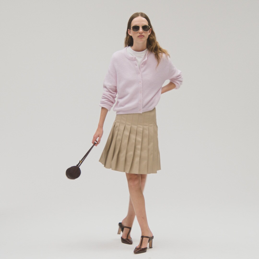 Pleated knee-length skirt in faux leather