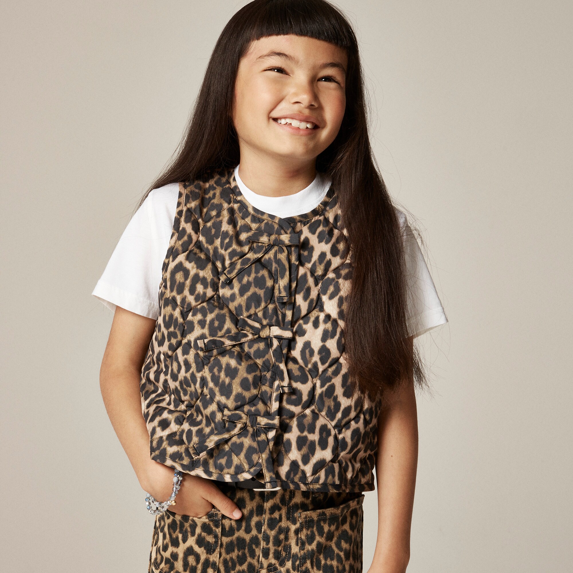 Girls' quilted vest in leopard print with PrimaLoft®
