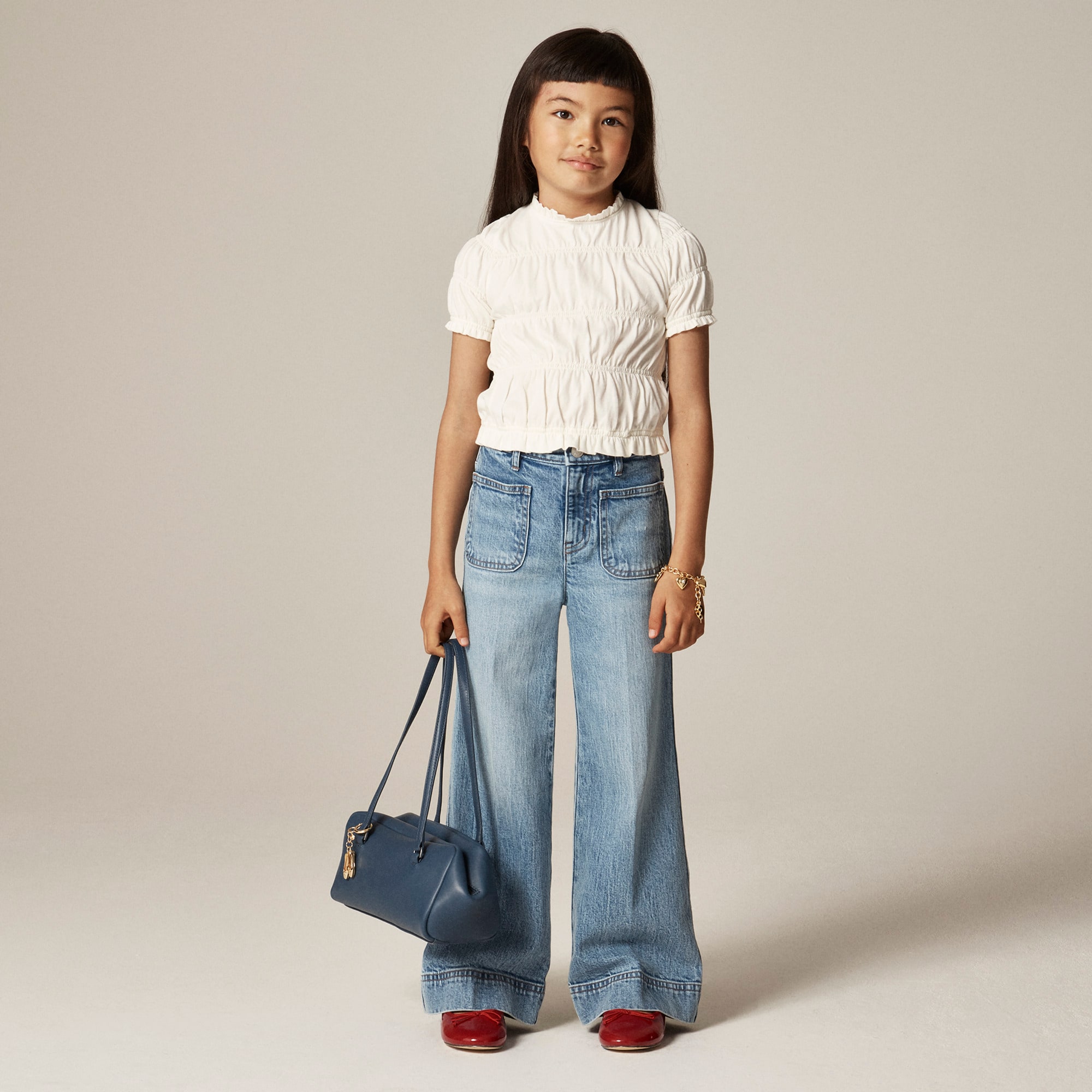 Girls' smocked T-shirt in broken-in-jersey