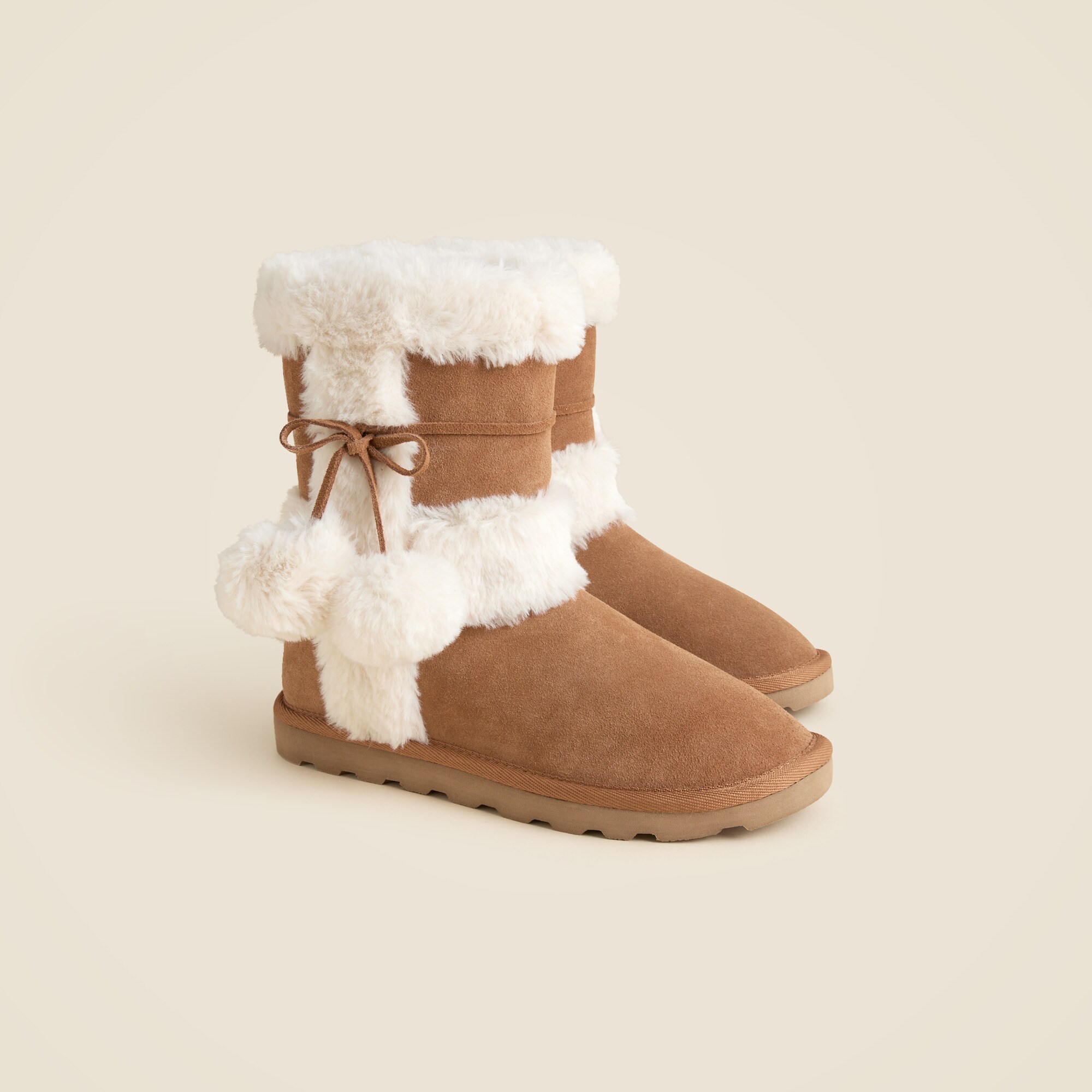 Faux-fur booties in suede with pom-poms