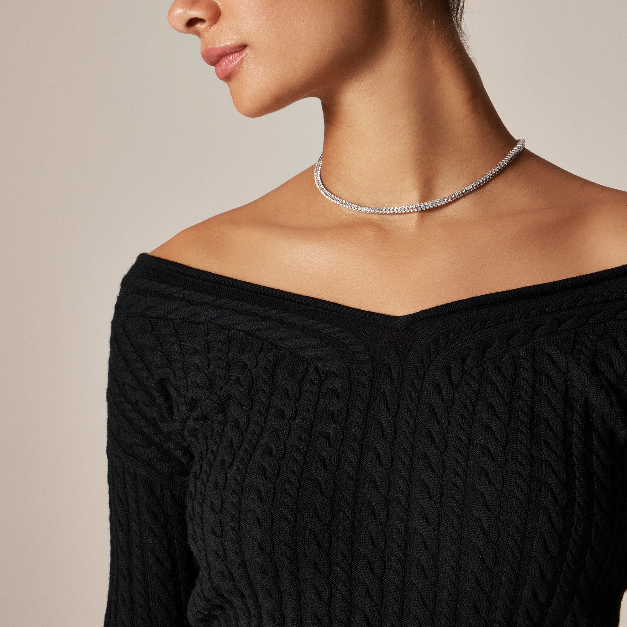 Cable-knit wide V-neck sweater in merino wool