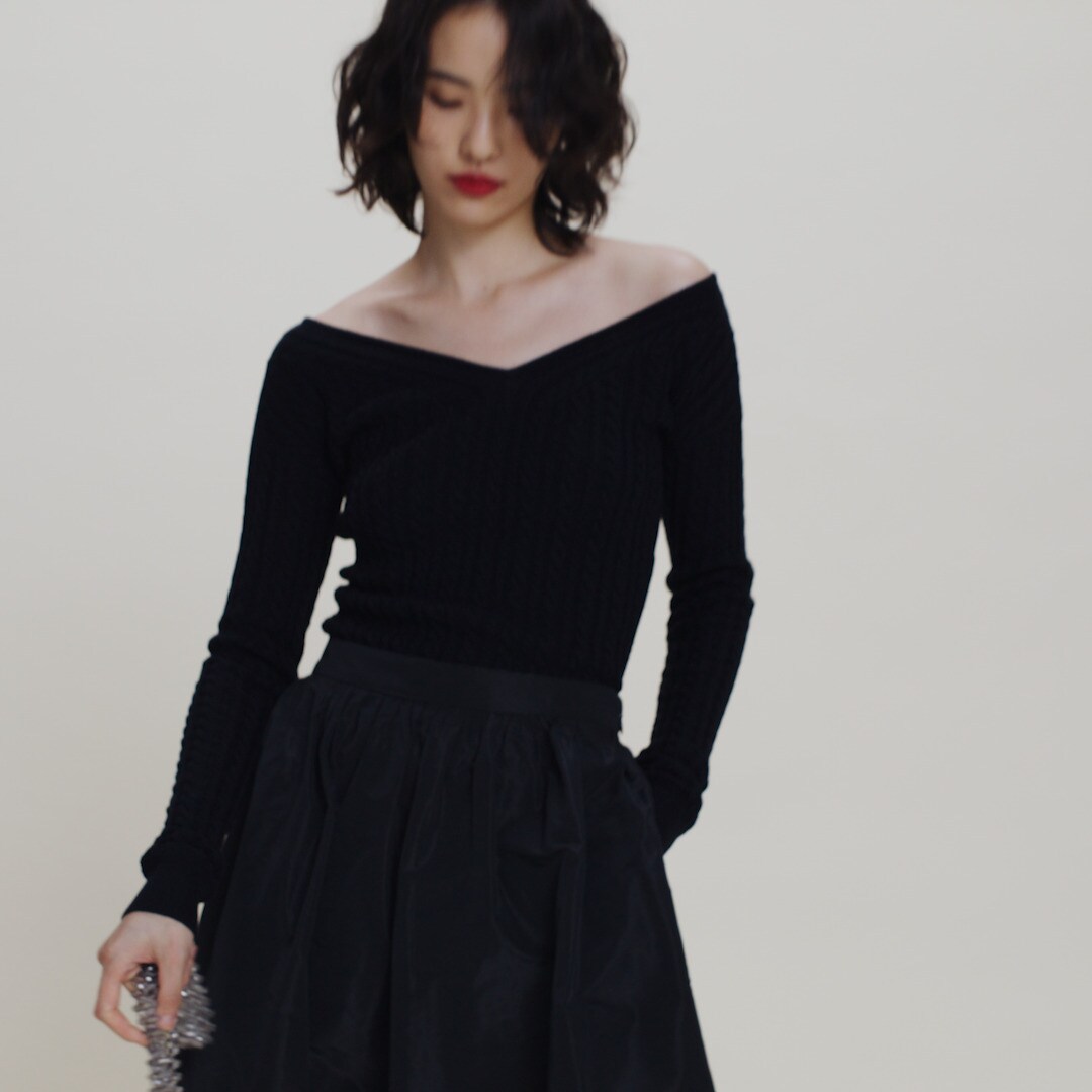 Cable-knit wide V-neck sweater in merino wool