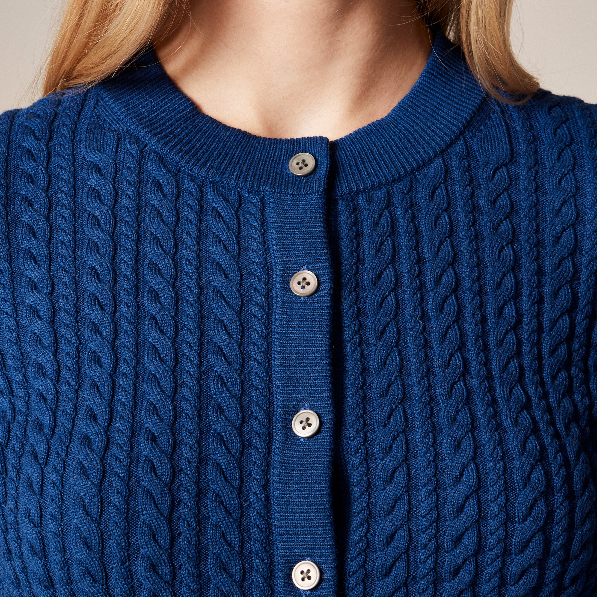 Cable-knit crewneck cardigan in merino wool