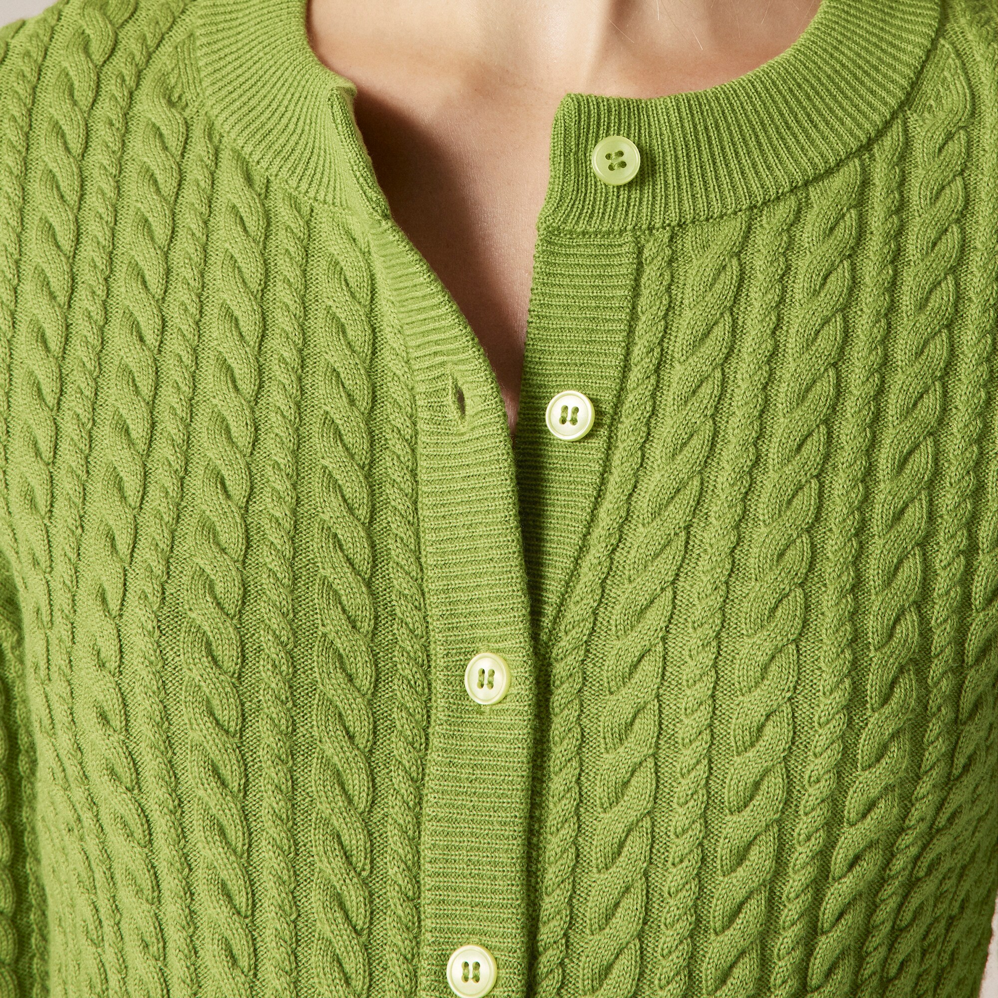 Cable-knit crewneck cardigan in merino wool