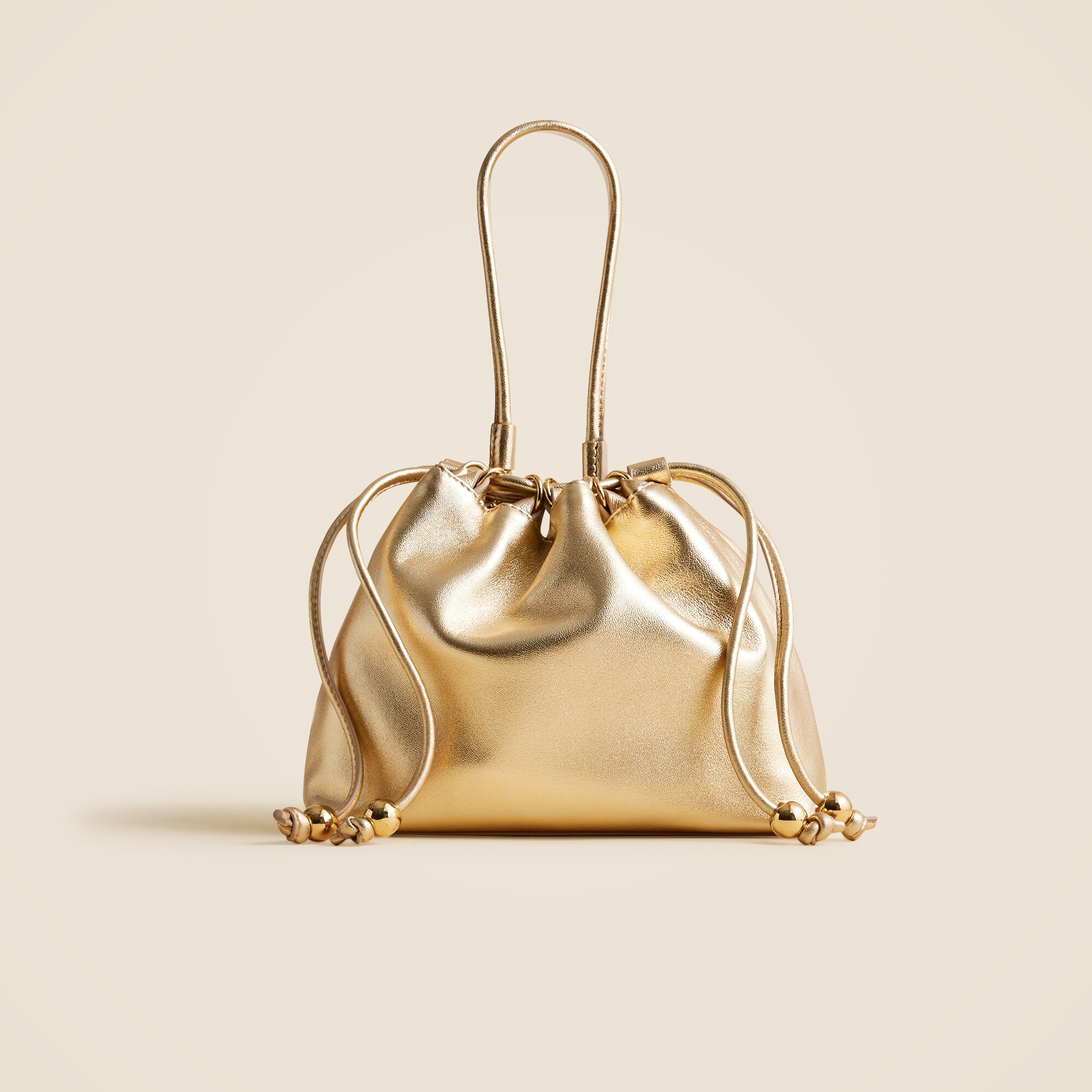 Drawstring pouch bag in metallic leather