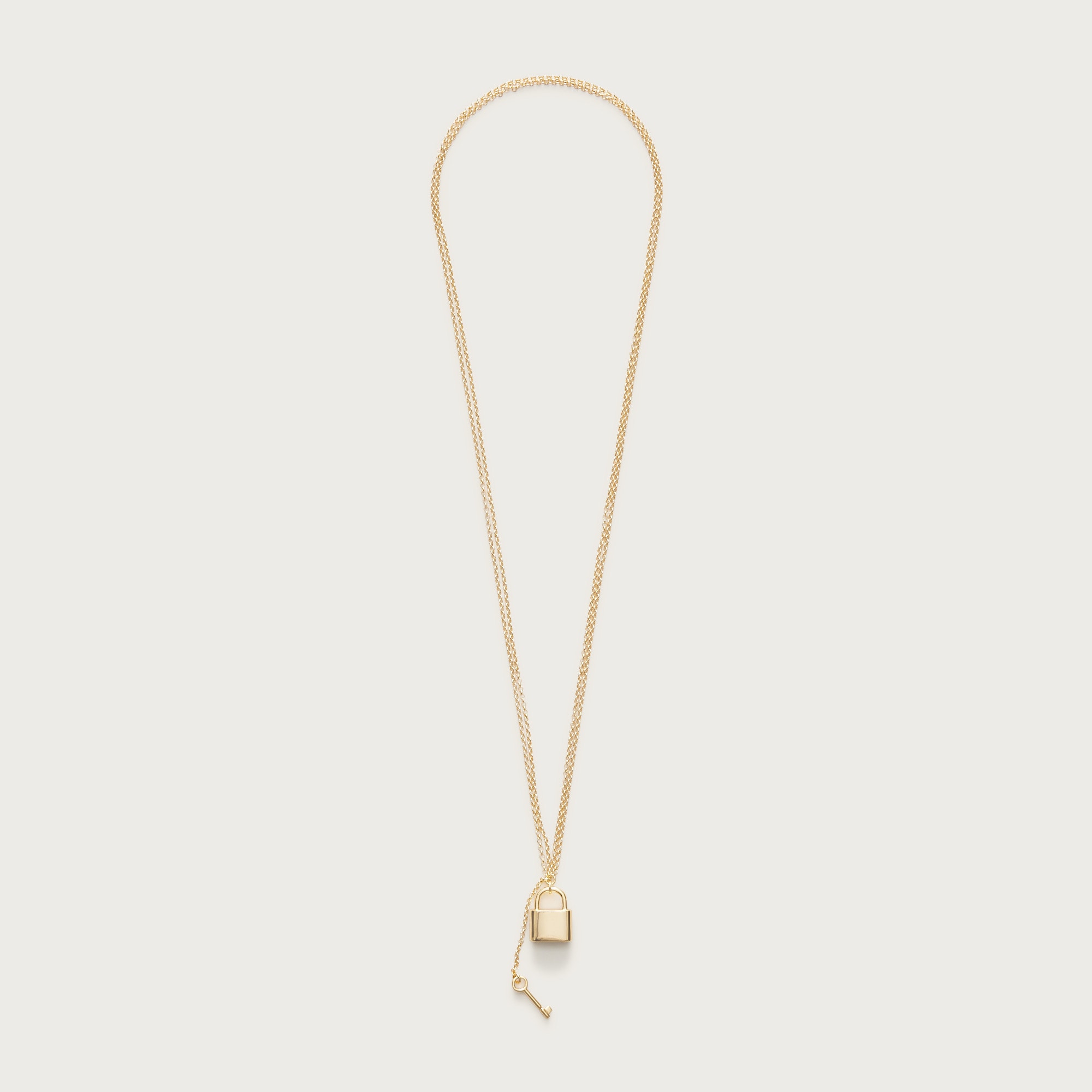 Metallic lock and key pendant necklace