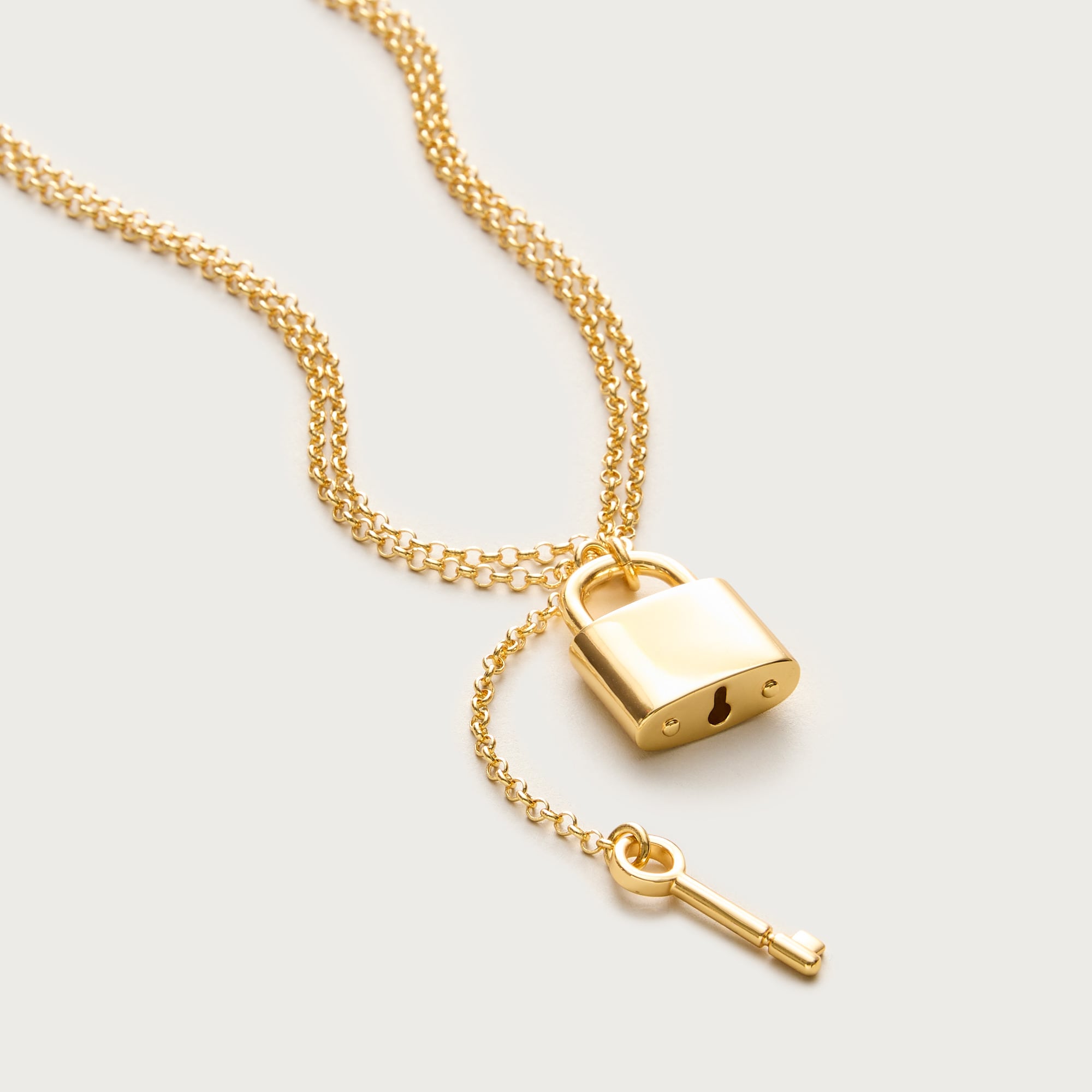 Metallic lock and key pendant necklace