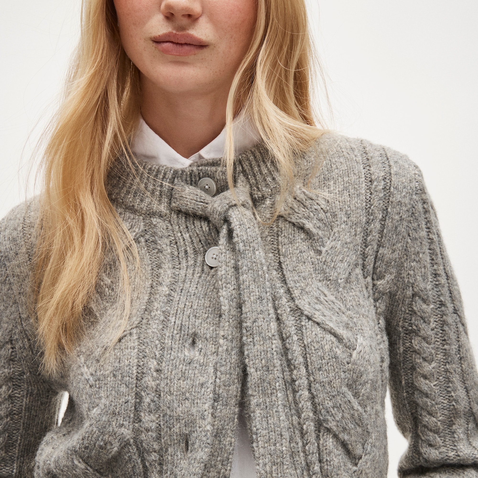 Cable-knit bow cardigan in wool blend