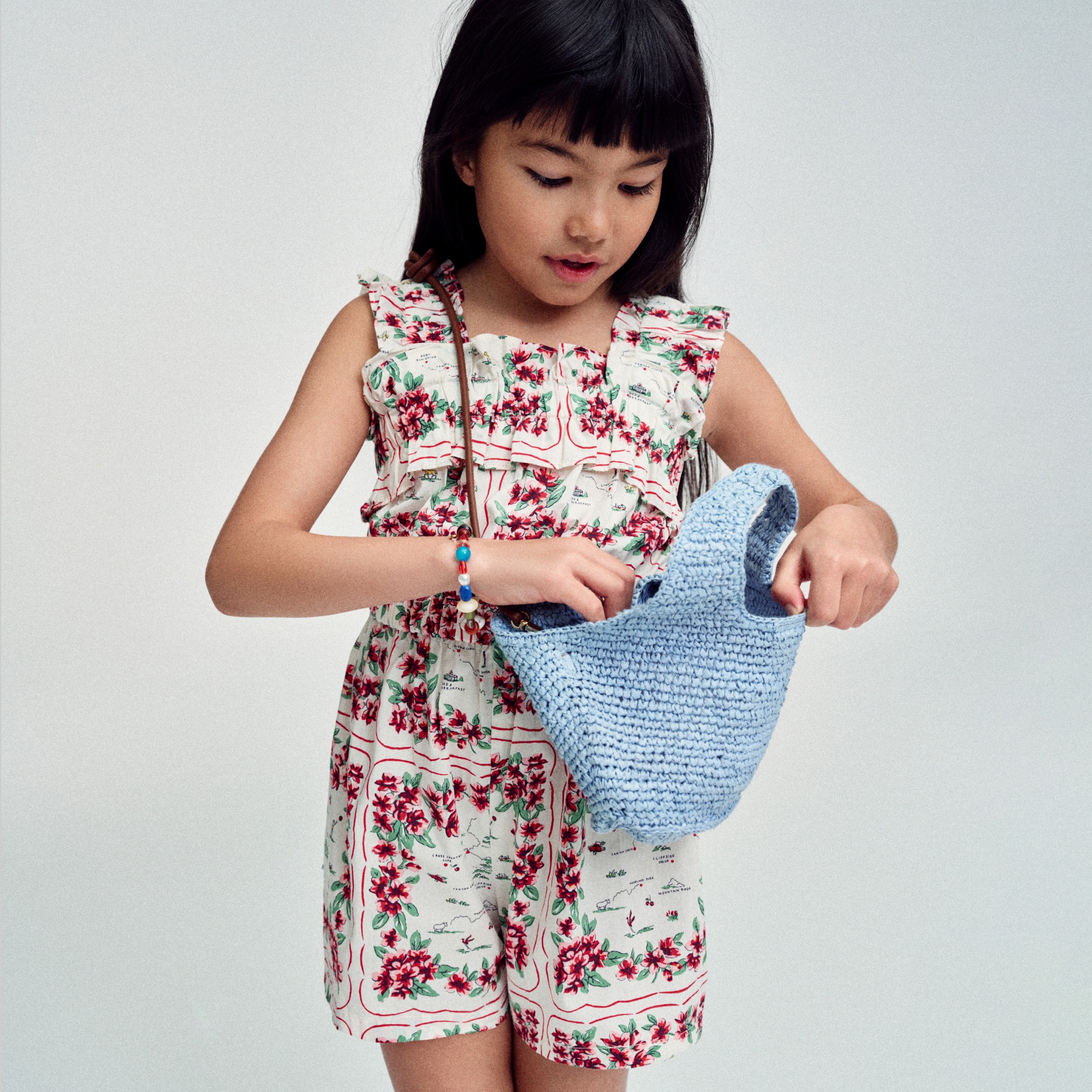 Girls' ruffle-trim romper in map floral
