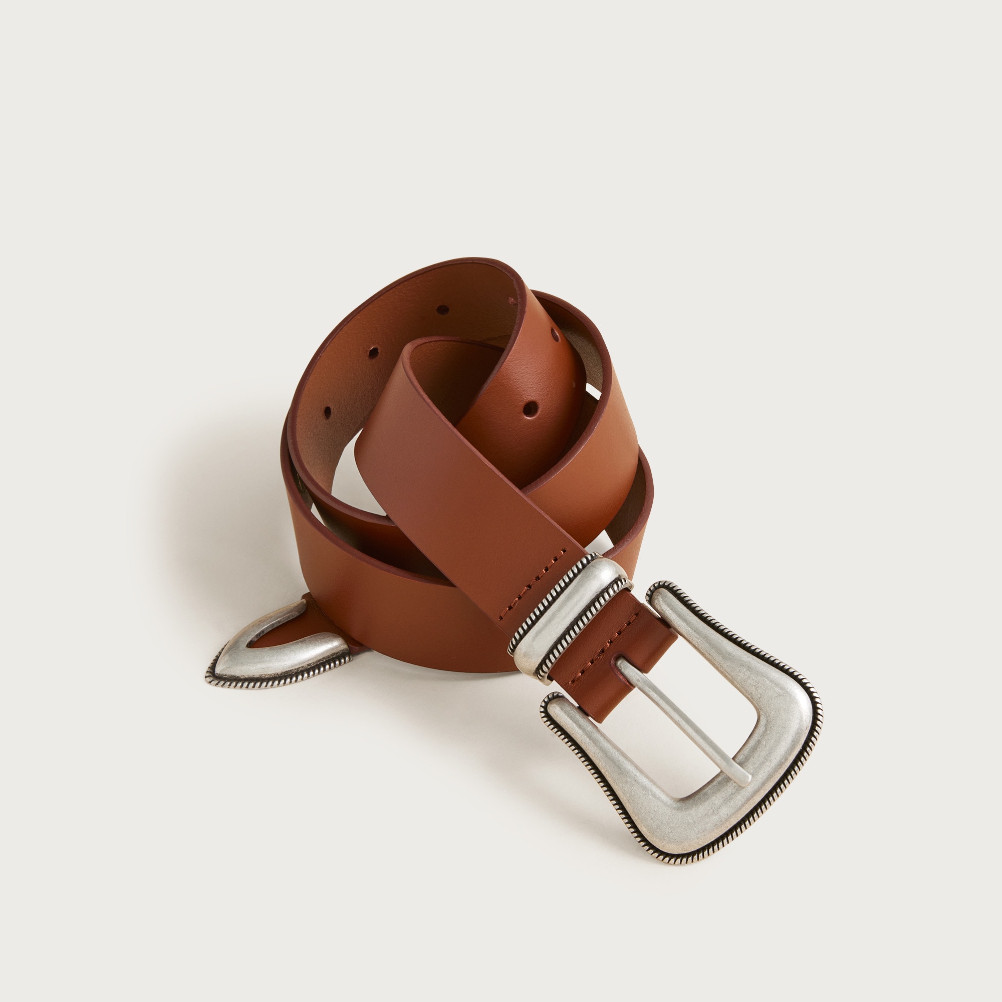 Western leather belt with metal tip