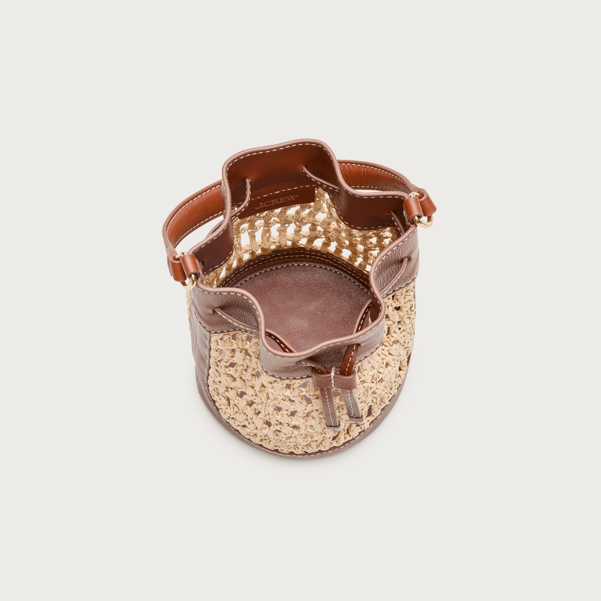 Drawstring bag in straw and leather