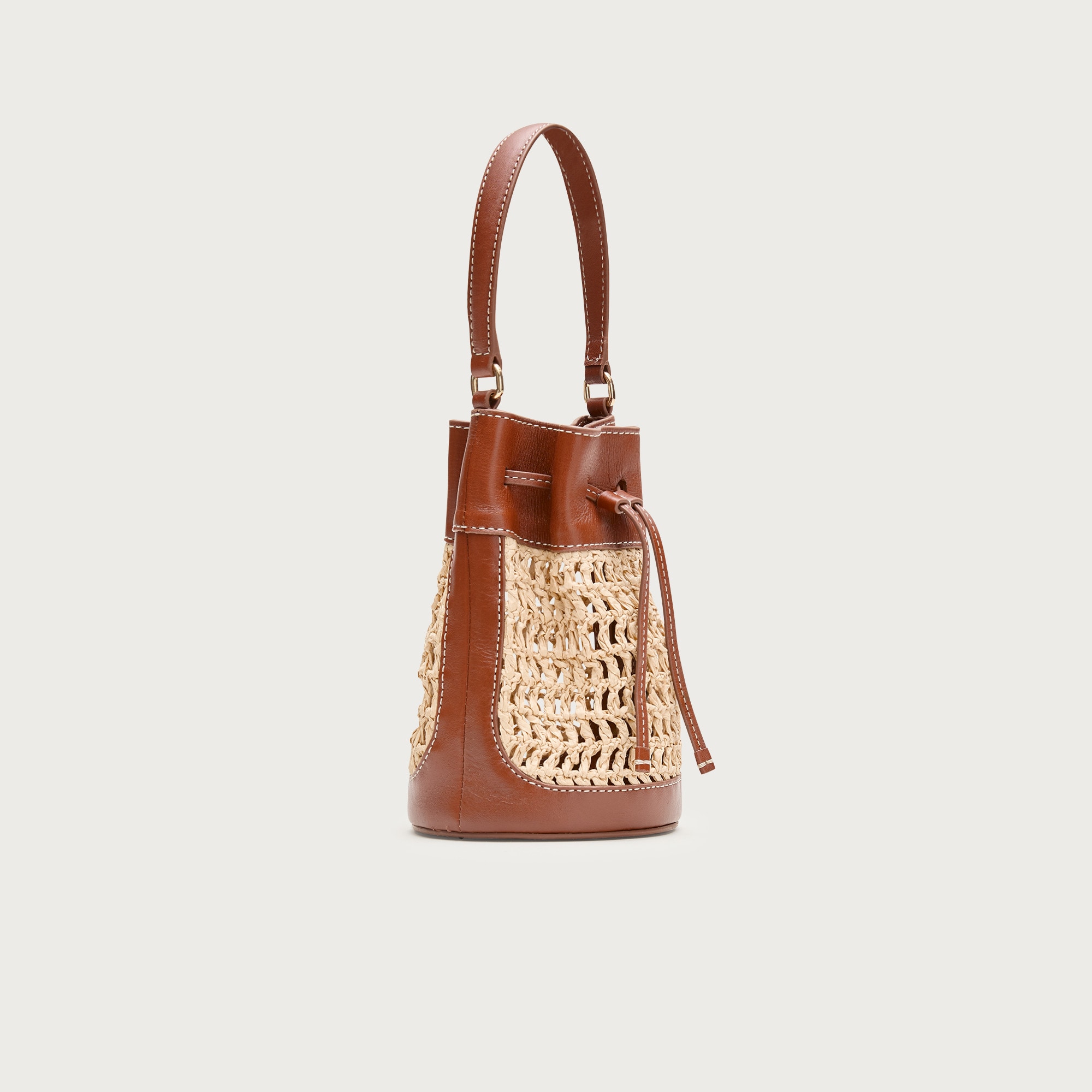 Drawstring bag in straw and leather