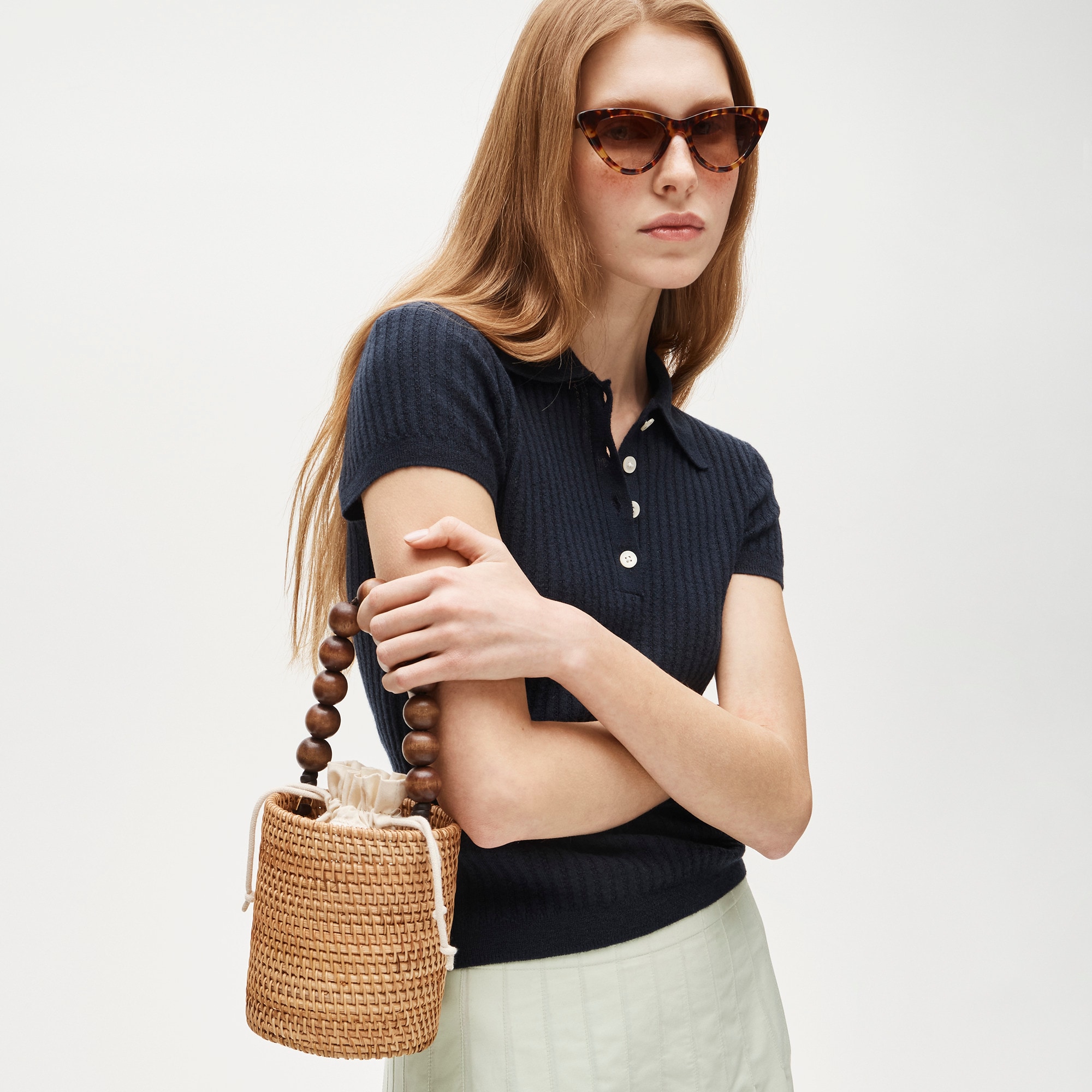 Handknotted rattan bucket bag with wood beads