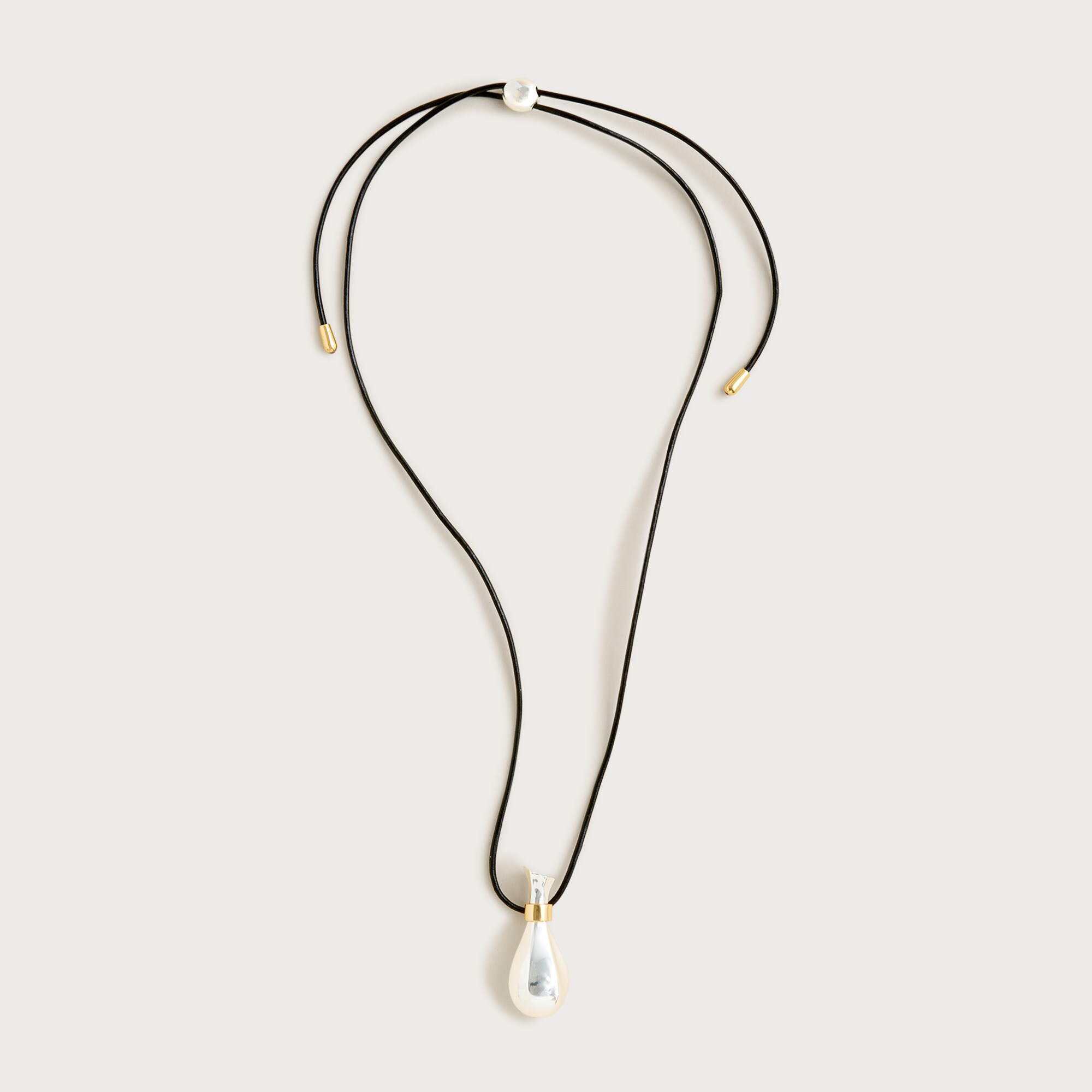 Metallic pendant necklace with leather cord