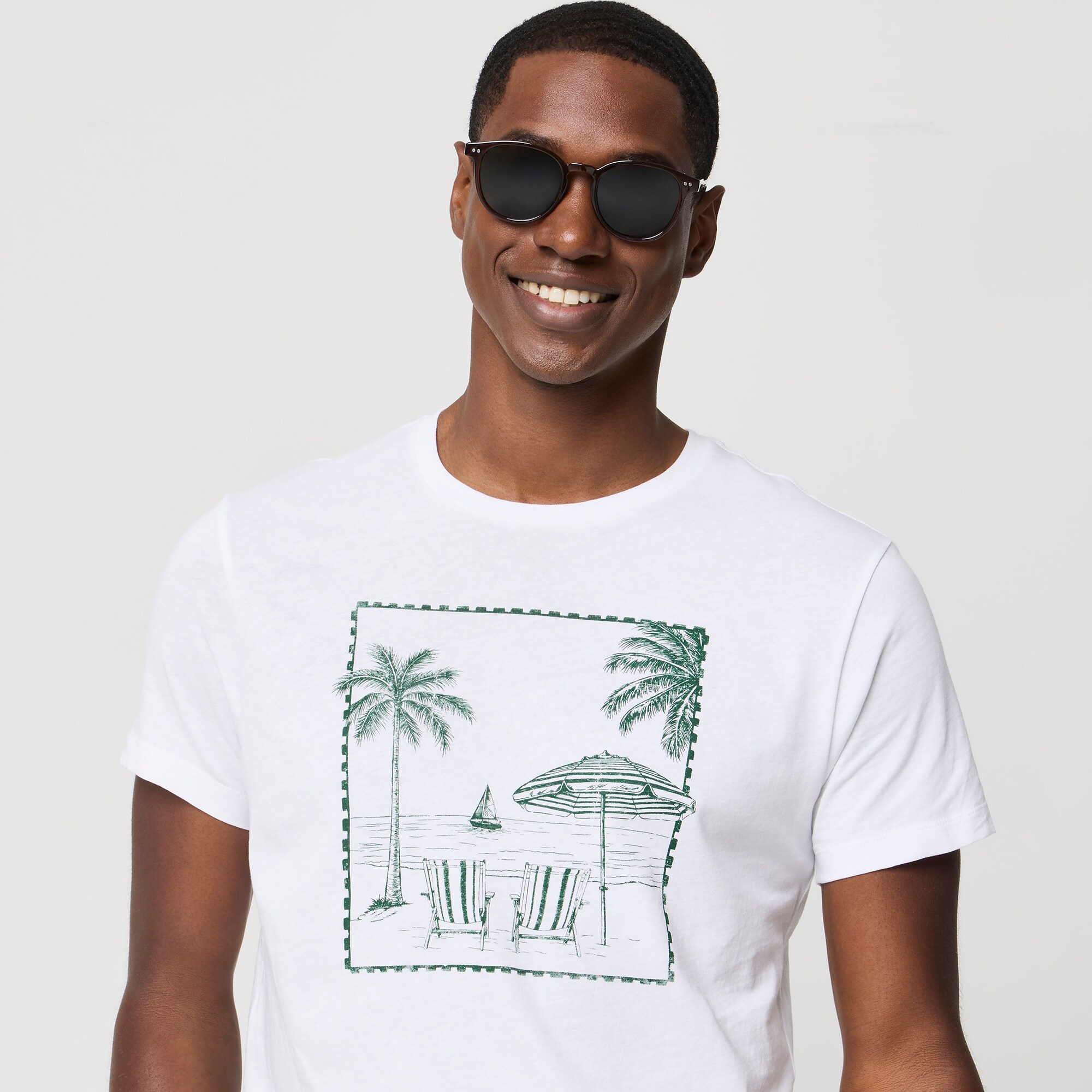 Beach lounge scene graphic tee