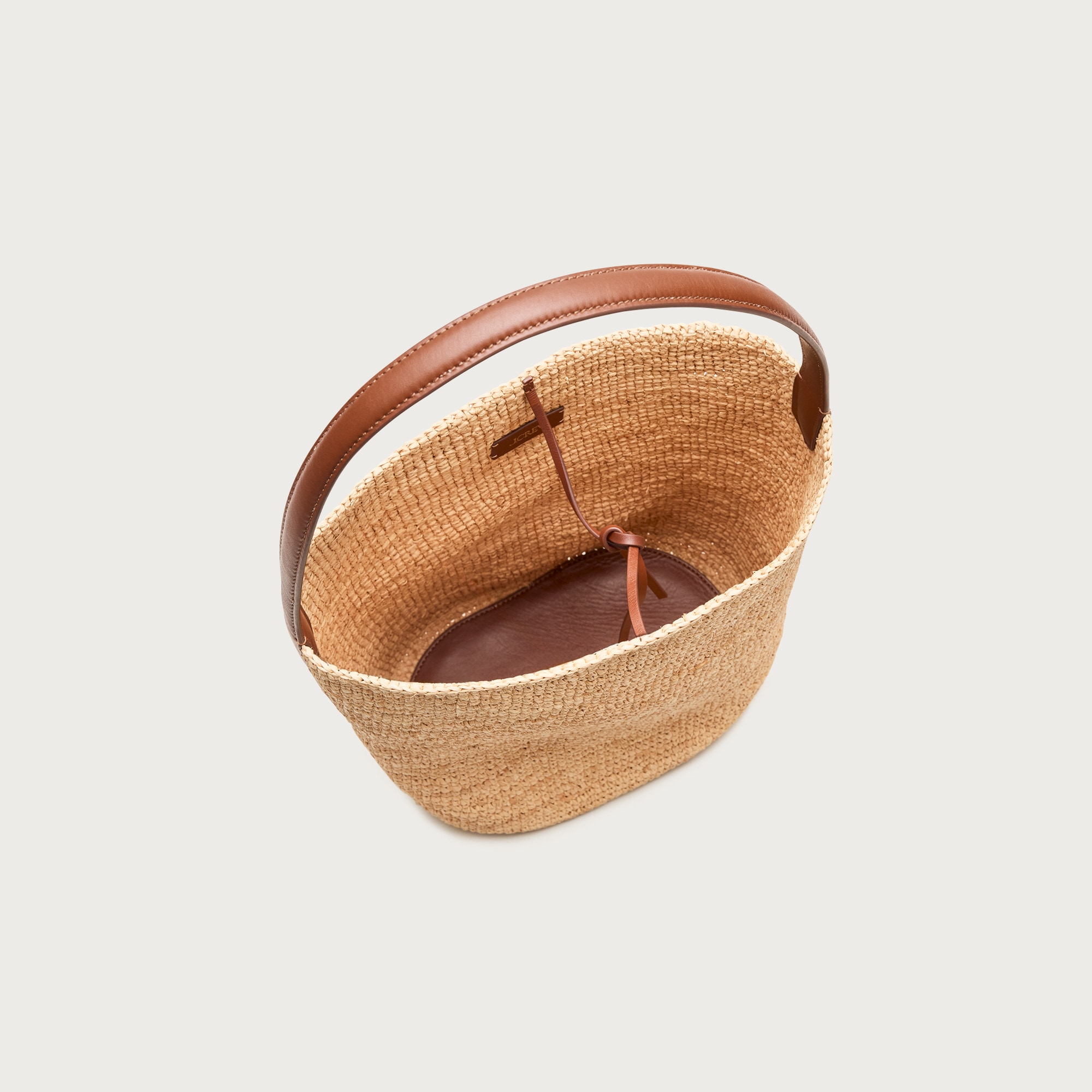 Berkeley handknotted bucket bag in raffia